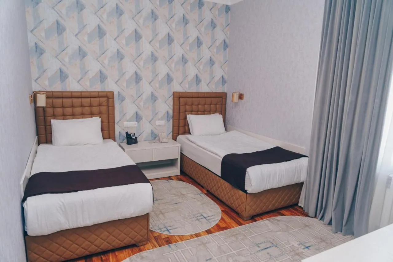 Bed in Asmald Palace Hotel