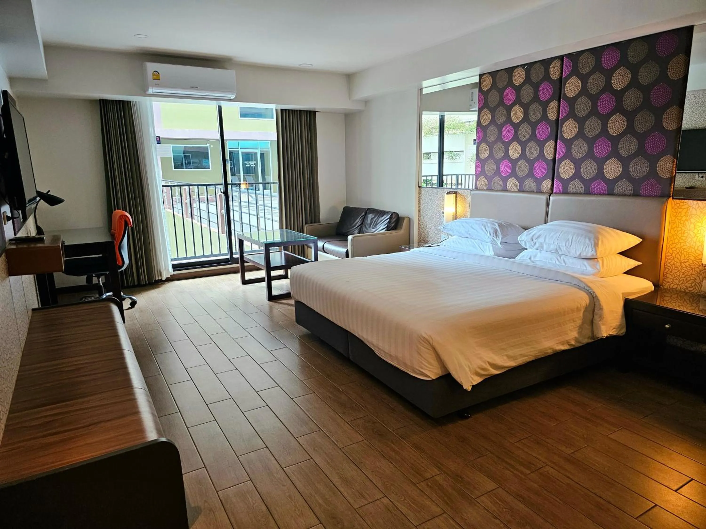 Bed in Dynasty Grande Hotel