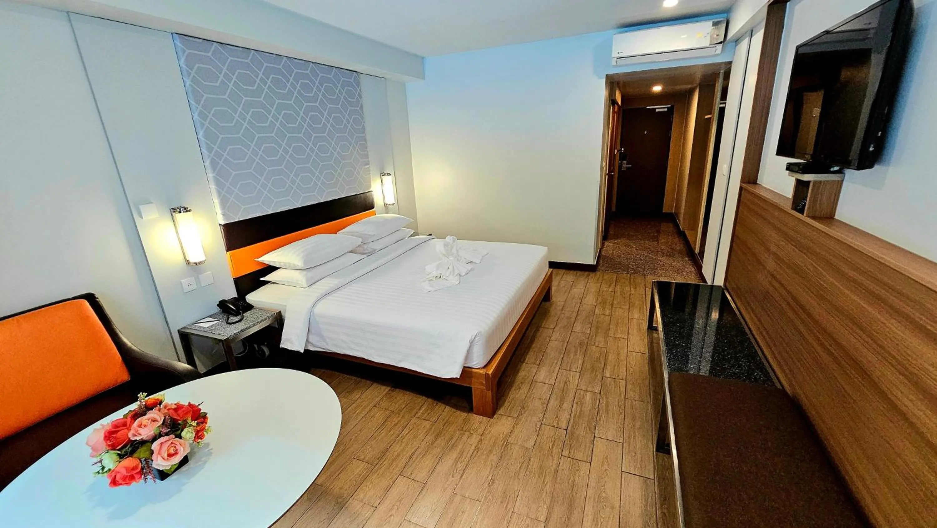 Bed in Dynasty Grande Hotel