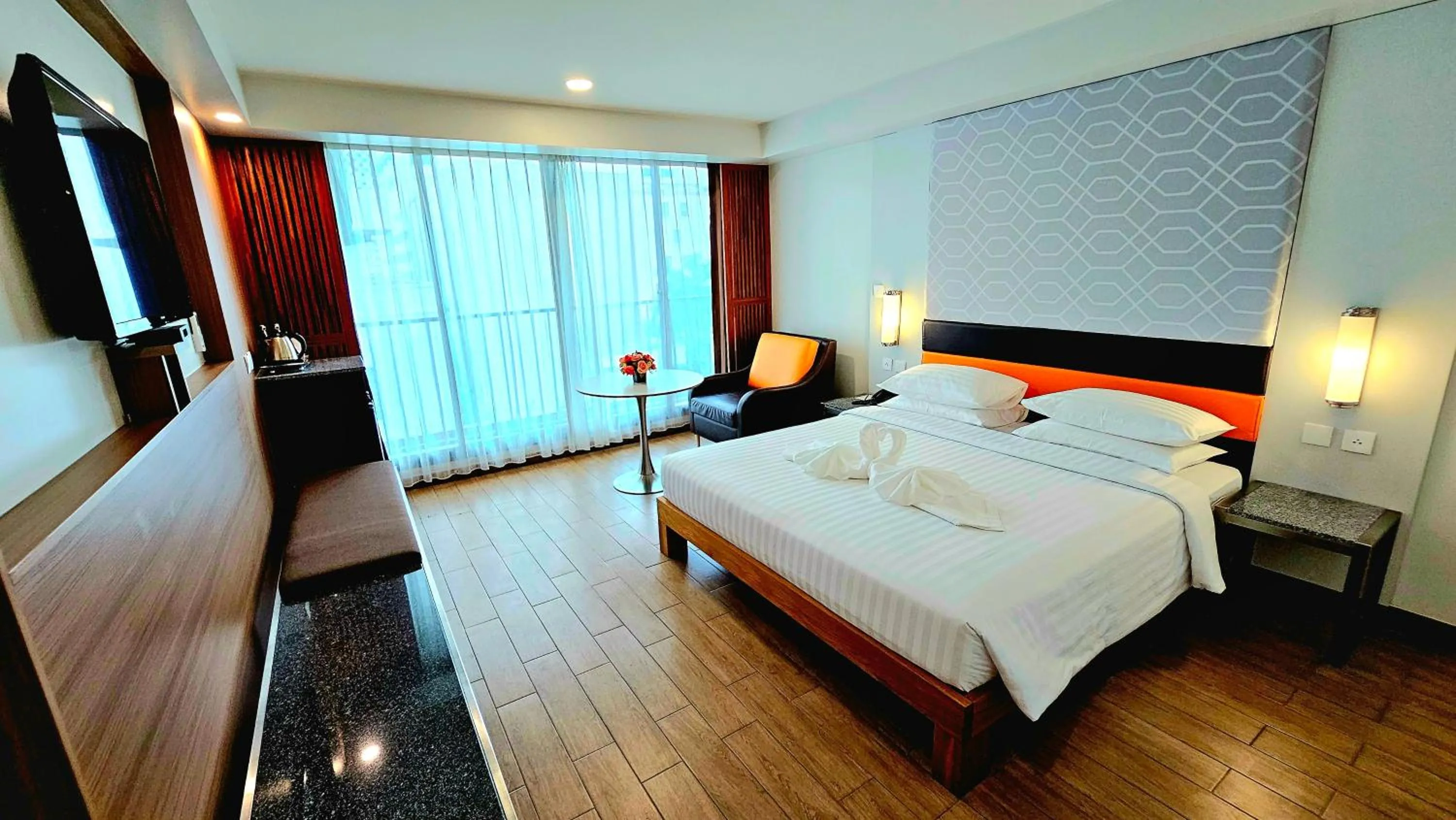 Bed in Dynasty Grande Hotel
