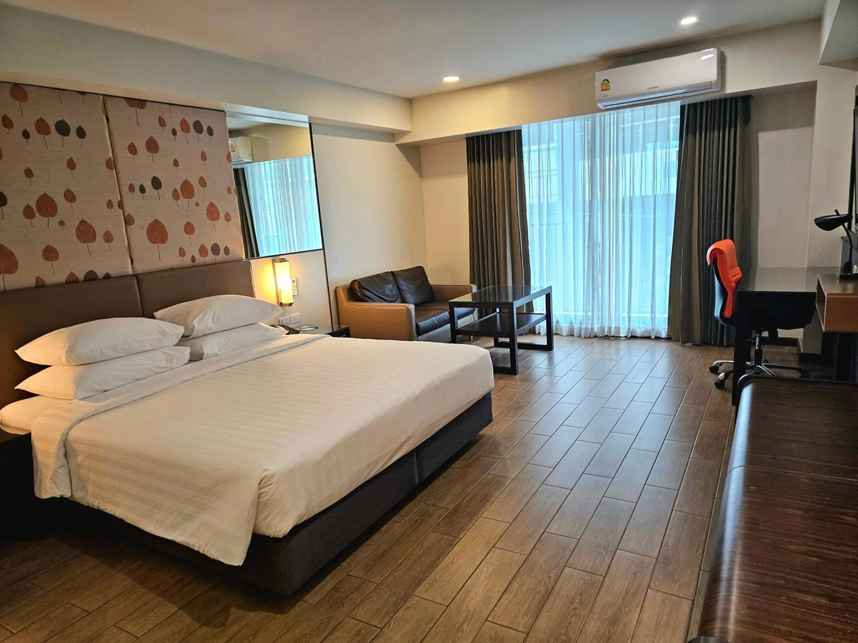 Bed in Dynasty Grande Hotel