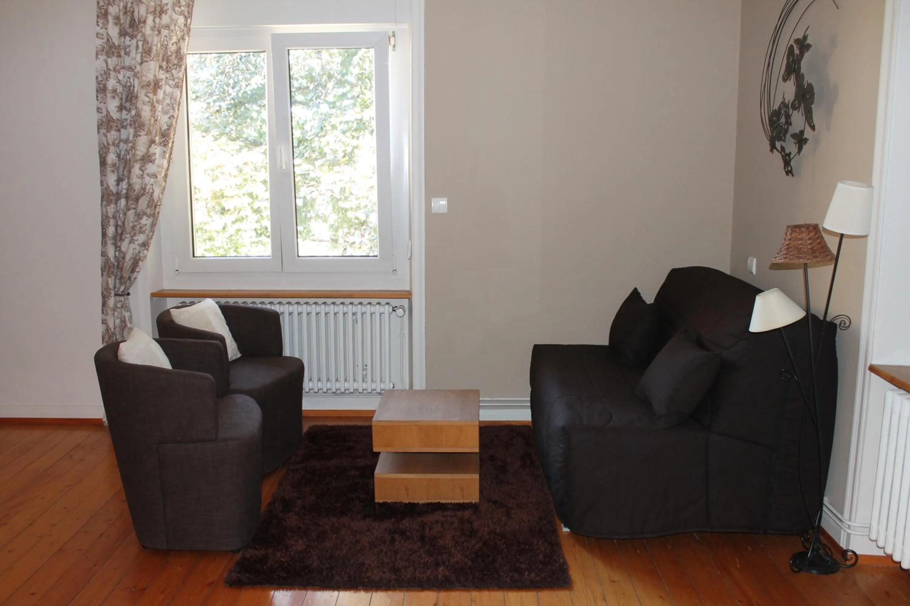 Seating area in Aux Berges de la Thur