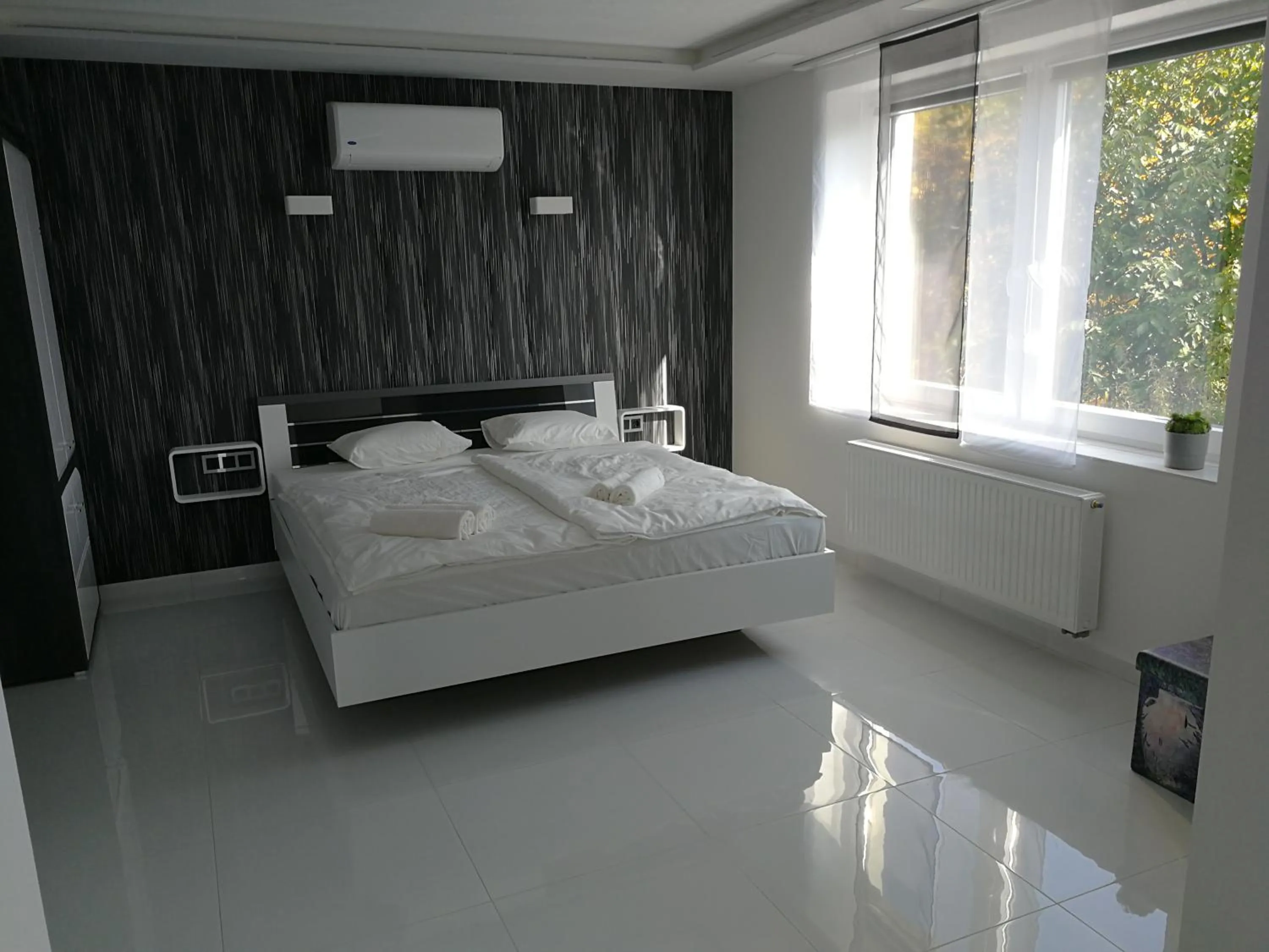 Bed in AQUA SOLAR APARTMANHÁZ