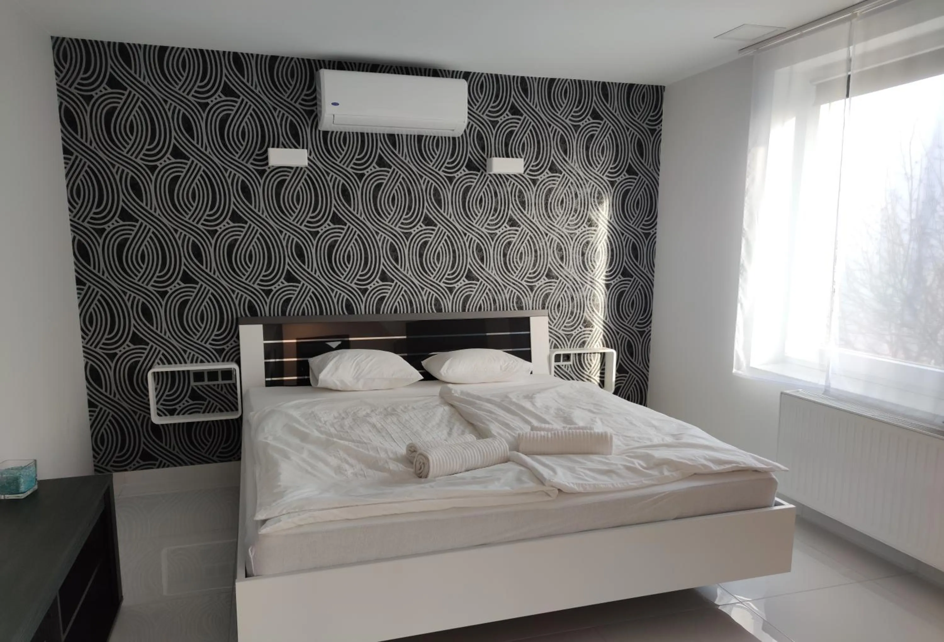 Bed in AQUA SOLAR APARTMANHÁZ