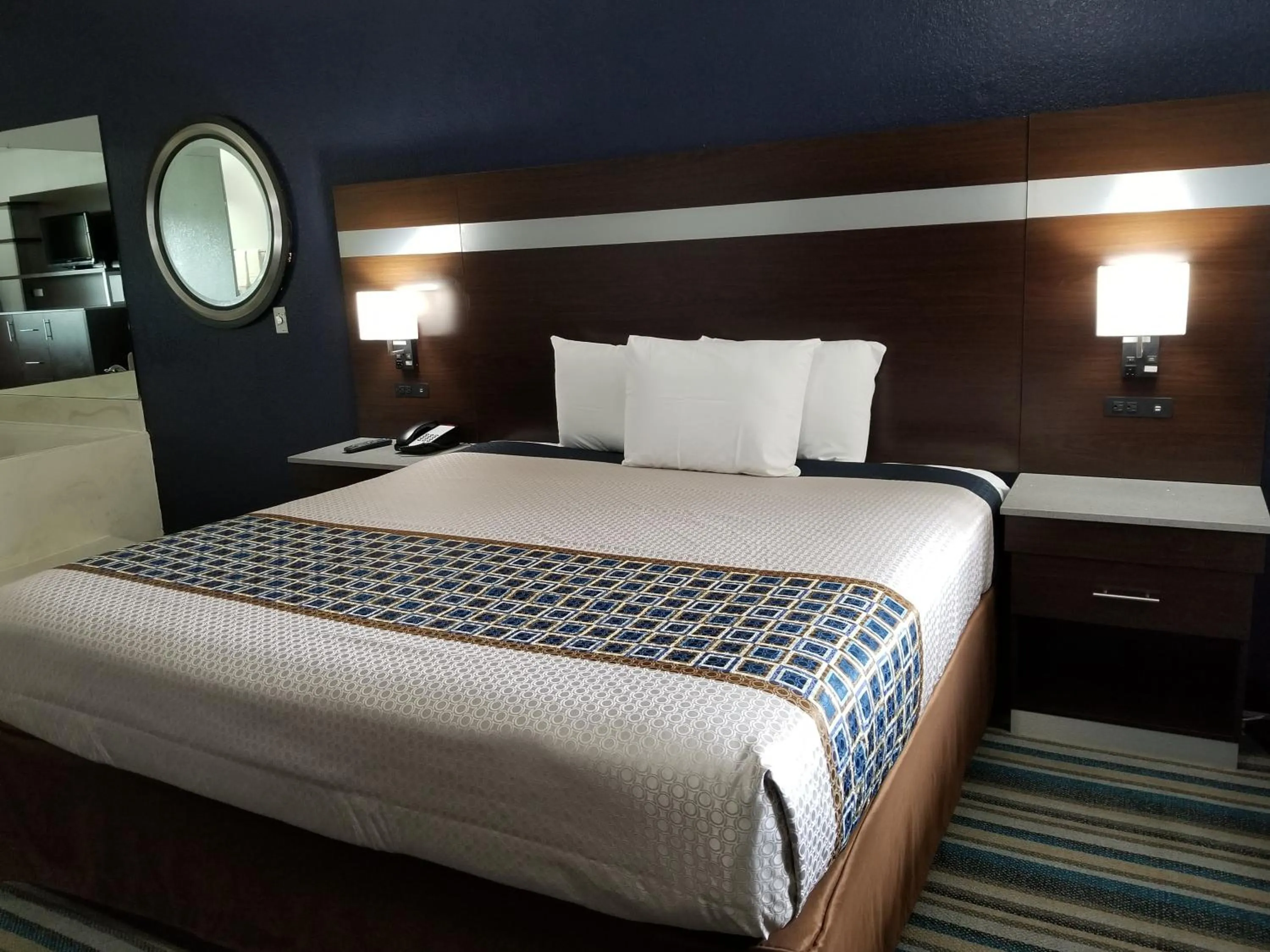 Bed in HomeBridge Inn and Suites