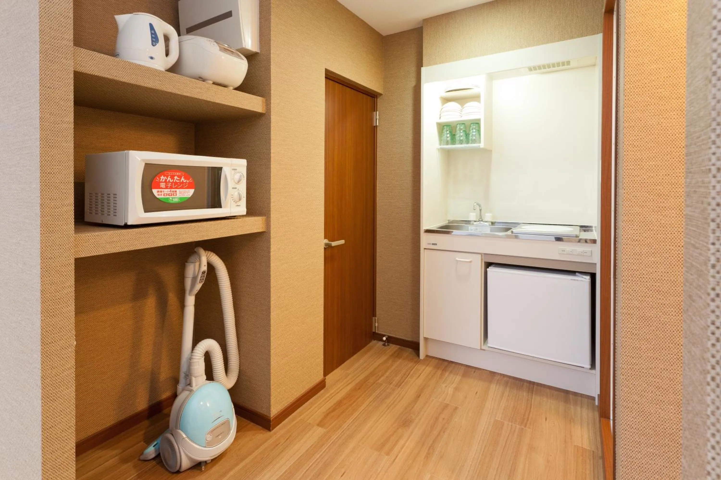 Kitchen or kitchenette in Hanabi Hotel