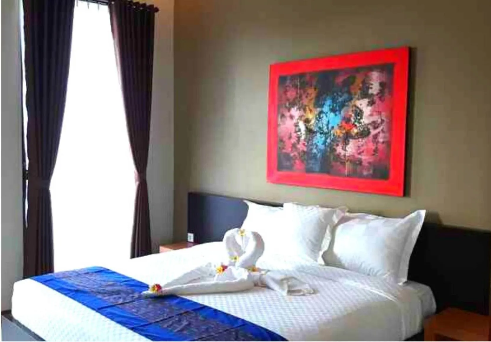 Bed in Asiana Lovina Hotel