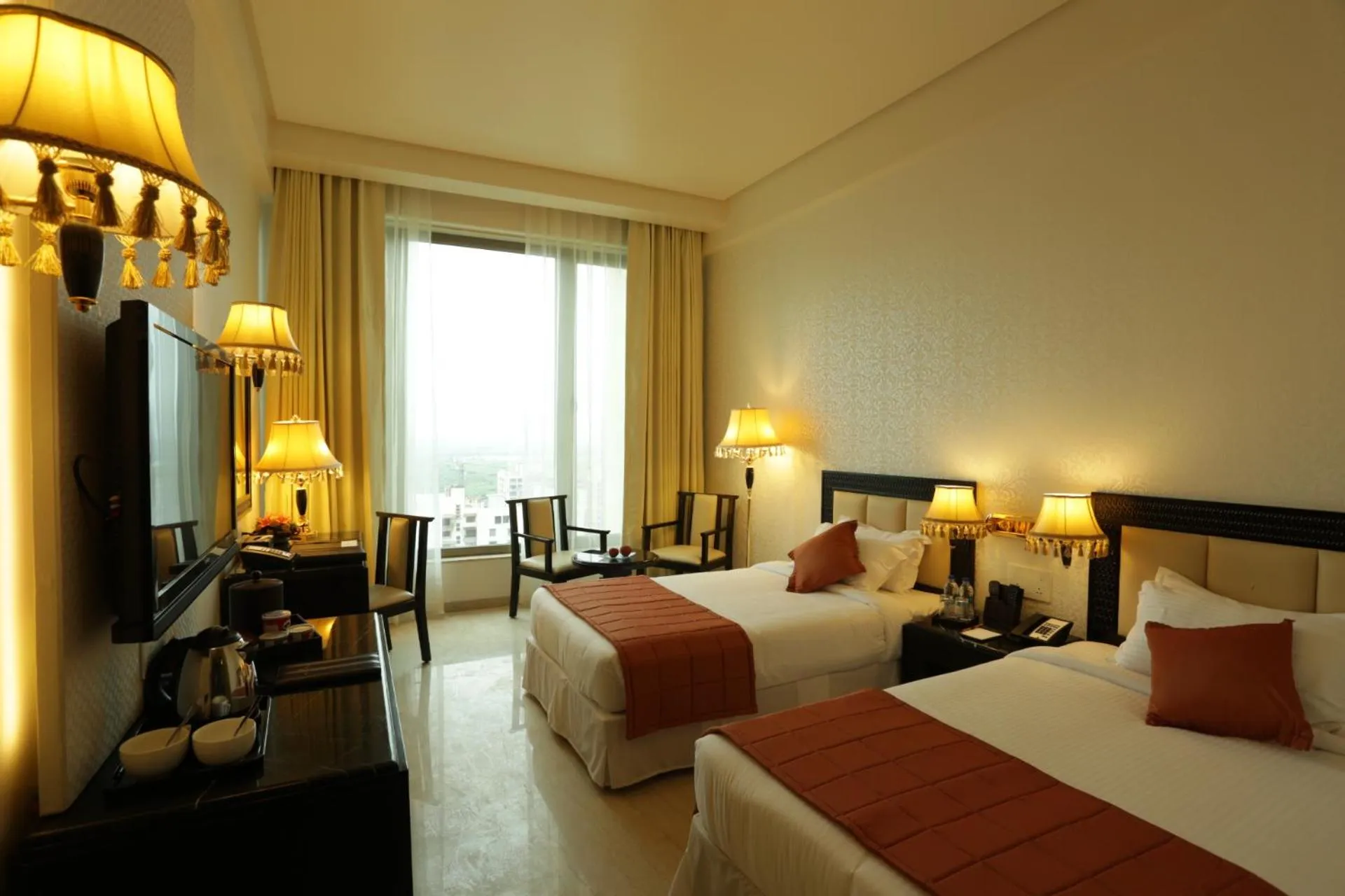 Bed in Royal Tulip Navi Mumbai