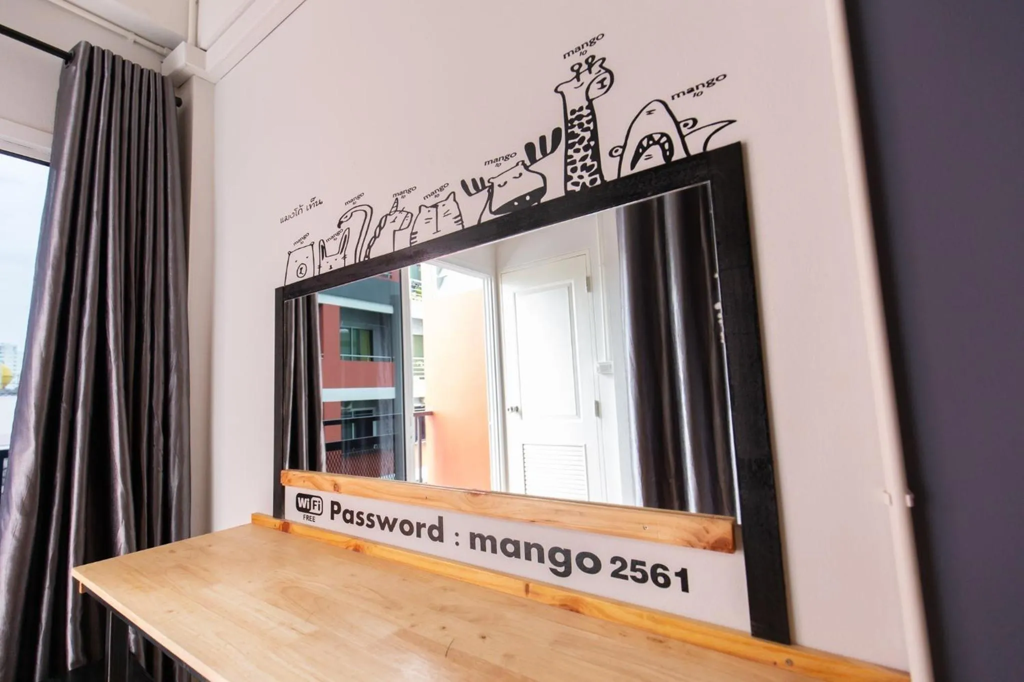 Property logo or sign in Mango 10 House