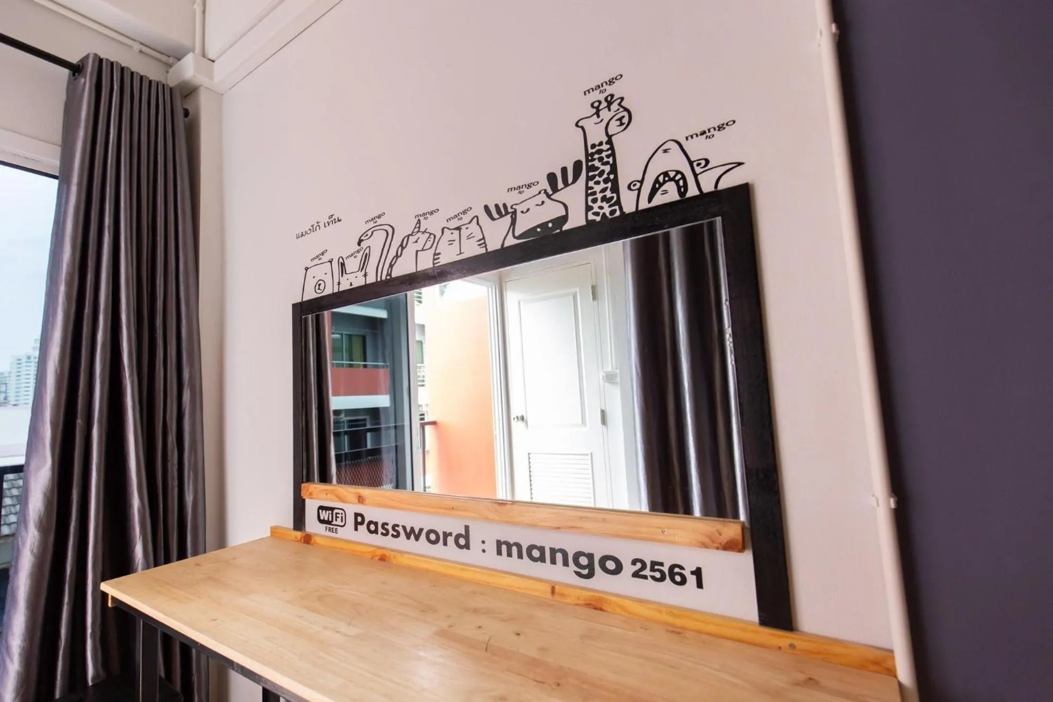 Property logo or sign in Mango 10 House