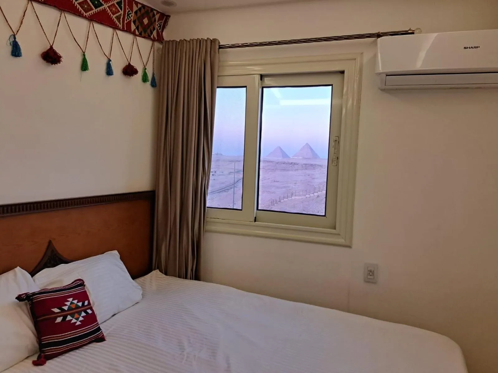 Bed in Atlantis Pyramids Inn