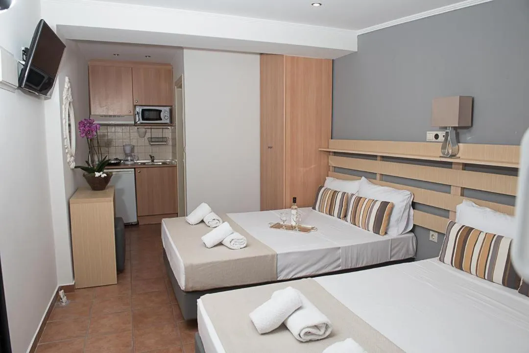 Photo of the whole room, Bed in Ammos Beach Seaside Luxury Suites Hotel