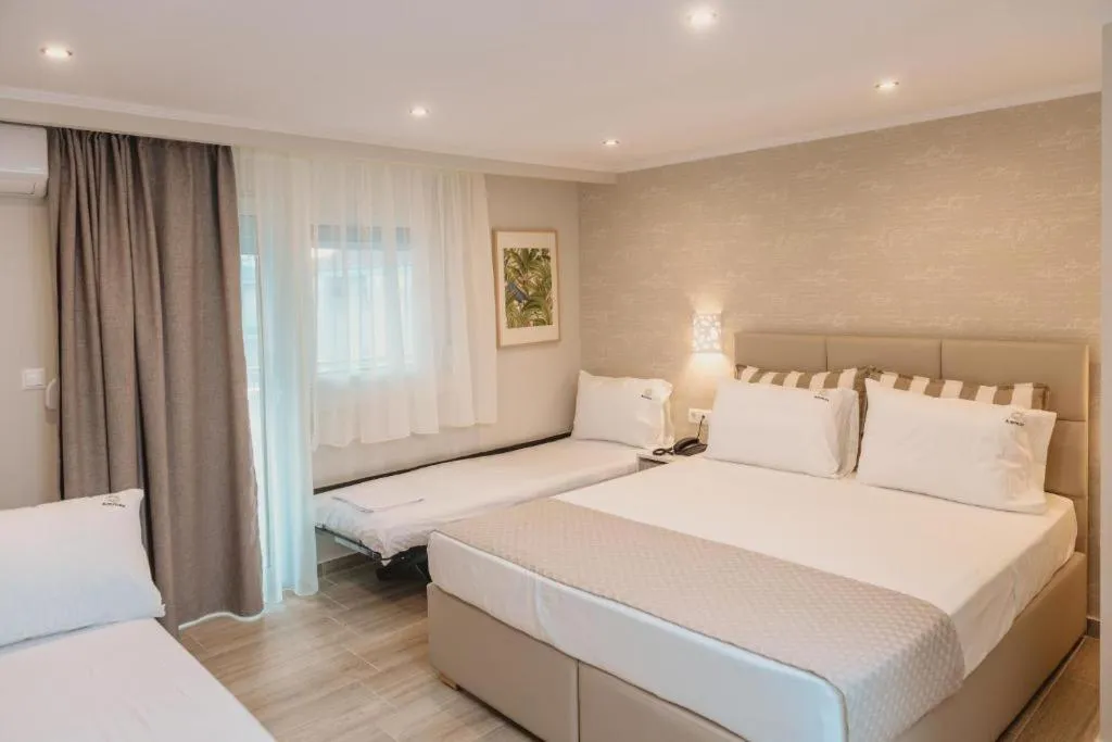 Photo of the whole room, Bed in Ammos Beach Seaside Luxury Suites Hotel