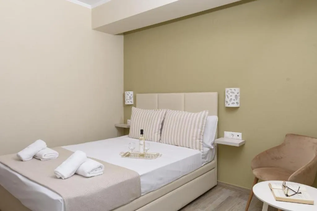 Photo of the whole room, Bed in Ammos Beach Seaside Luxury Suites Hotel