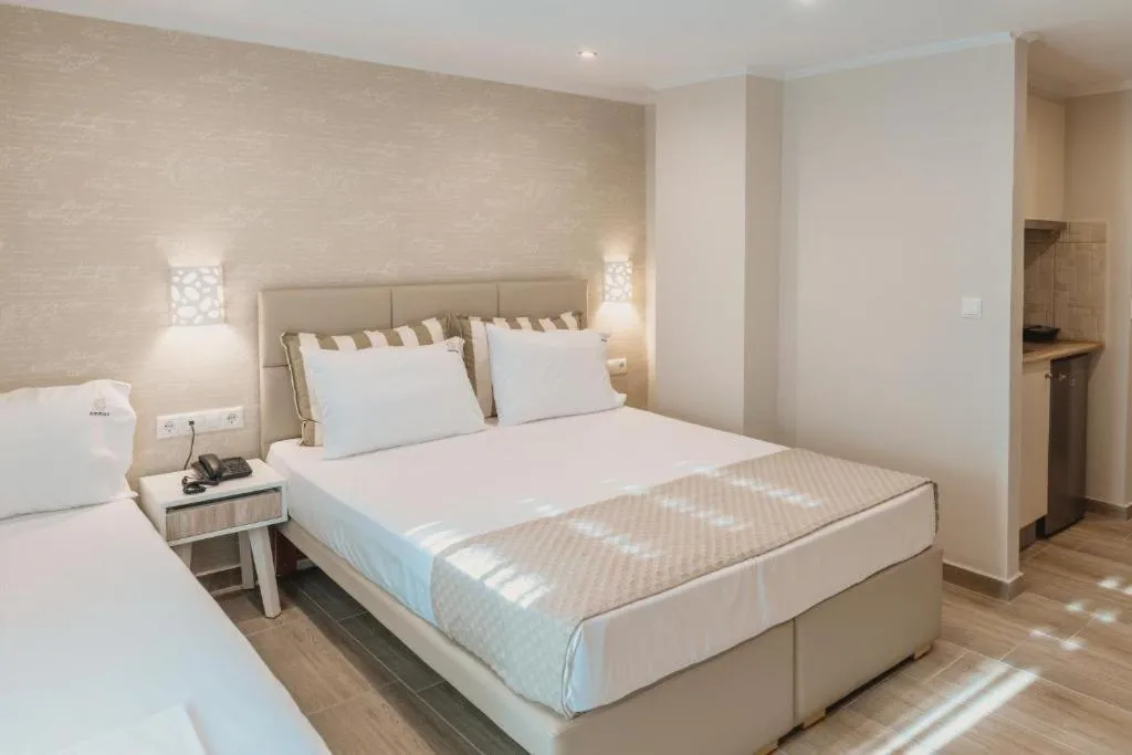 Photo of the whole room, Bed in Ammos Beach Seaside Luxury Suites Hotel