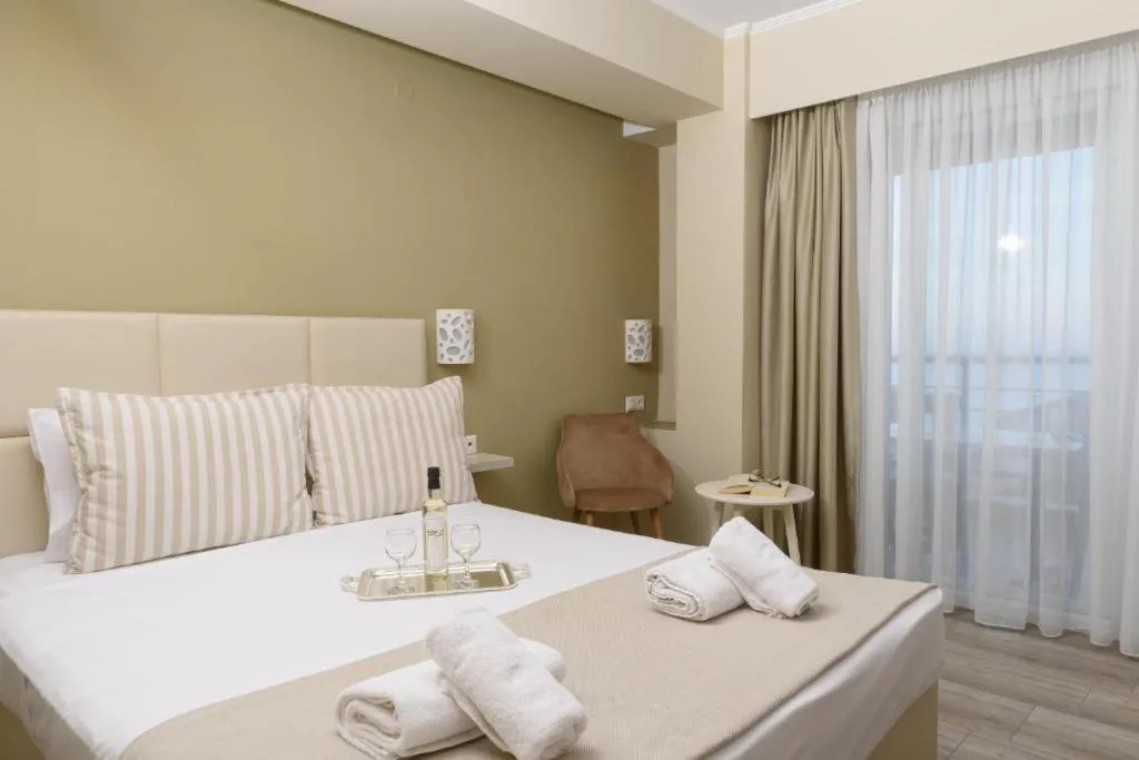 Photo of the whole room, Bed in Ammos Beach Seaside Luxury Suites Hotel