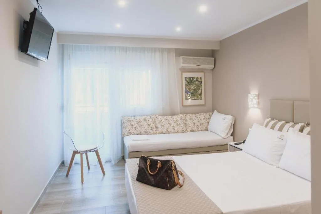 Photo of the whole room, Bed in Ammos Beach Seaside Luxury Suites Hotel