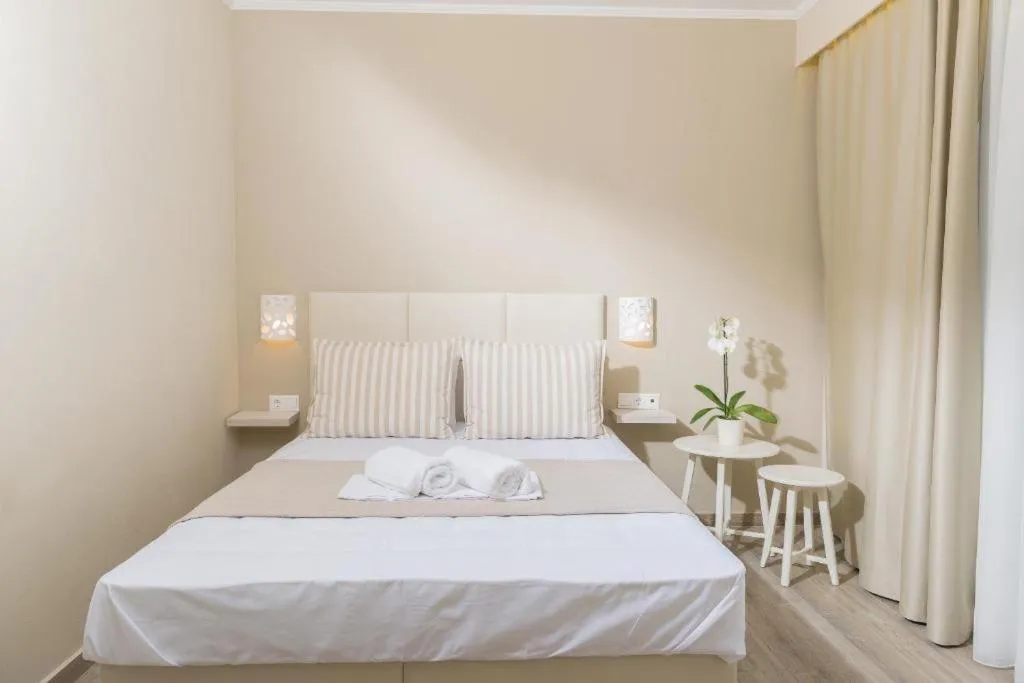 Photo of the whole room, Bed in Ammos Beach Seaside Luxury Suites Hotel