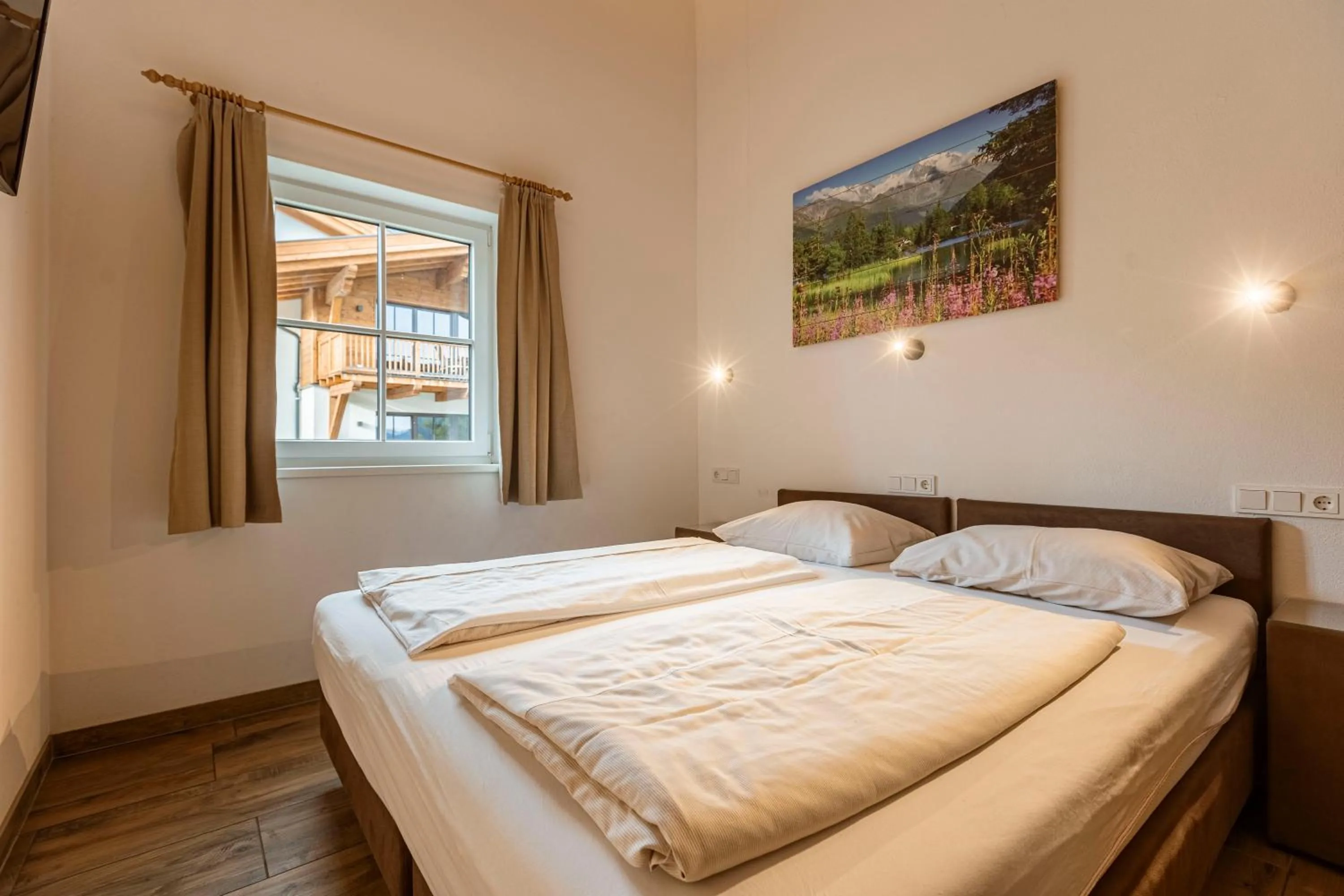 Bed in Tauernsuites Mitterwirt by ALPS RESORTS