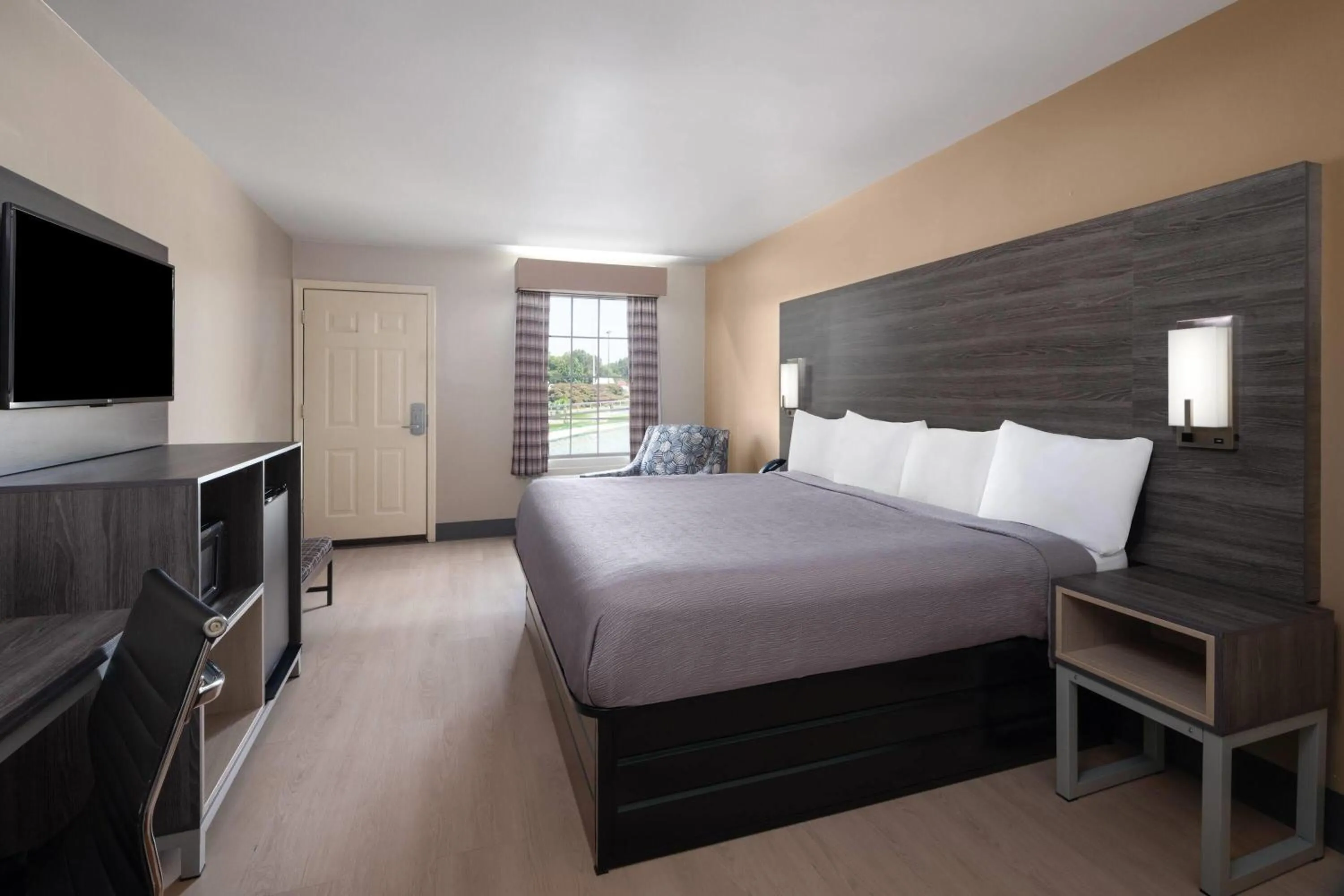 Photo of the whole room, Bed in Baymont by Wyndham Commerce GA Near Tanger Outlets Mall