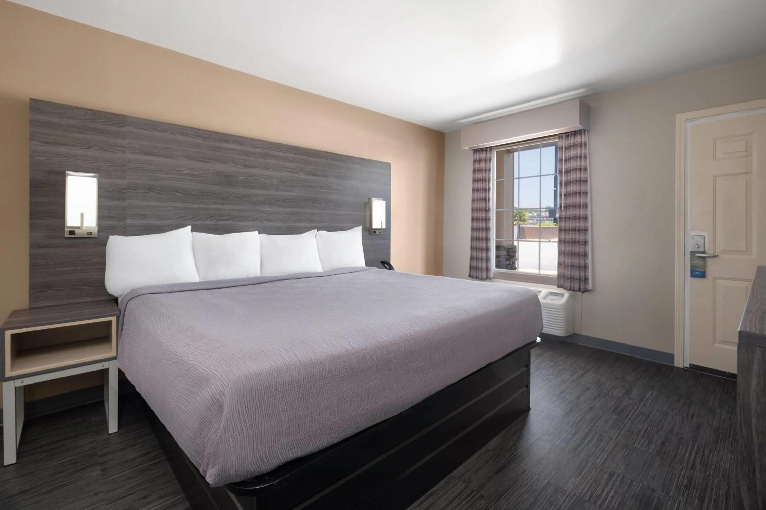 Photo of the whole room, Bed in Baymont by Wyndham Commerce GA Near Tanger Outlets Mall