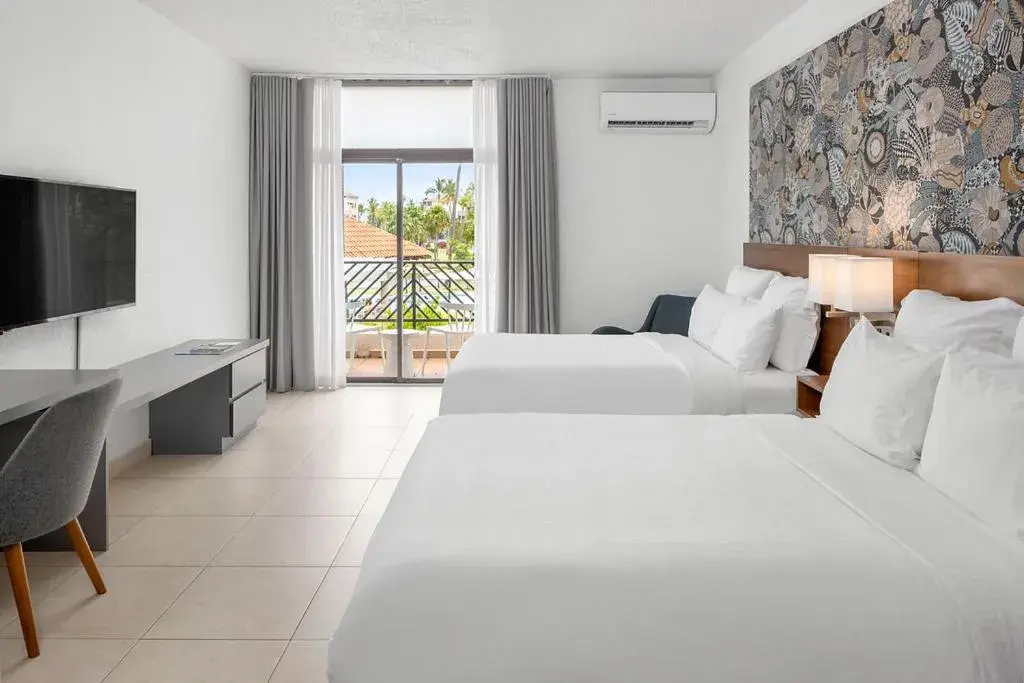 Costa Collection Queen Room with Two Queen Beds and Pool View - Balcony in Wyndham Palmas Beach and Golf Boutique Resort Costa Collection Queen Room with Two Queen Beds and Pool View - Balcony in Wyndham Palmas Beach and Golf Boutique Resort