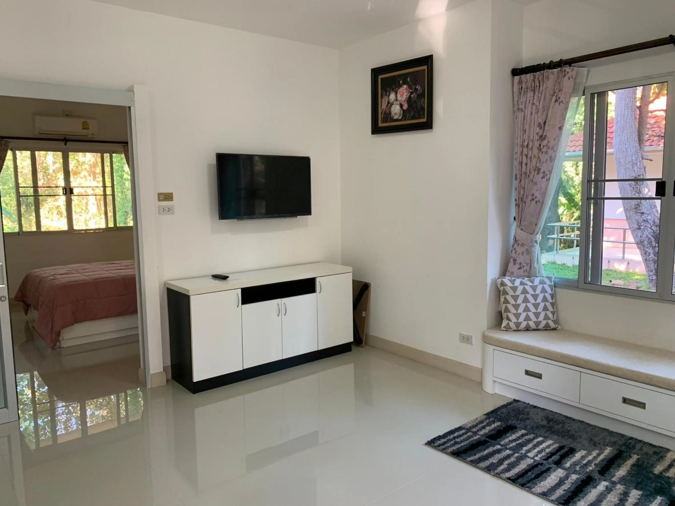 Seating area, Bed in Baan Ping Kan Longstay