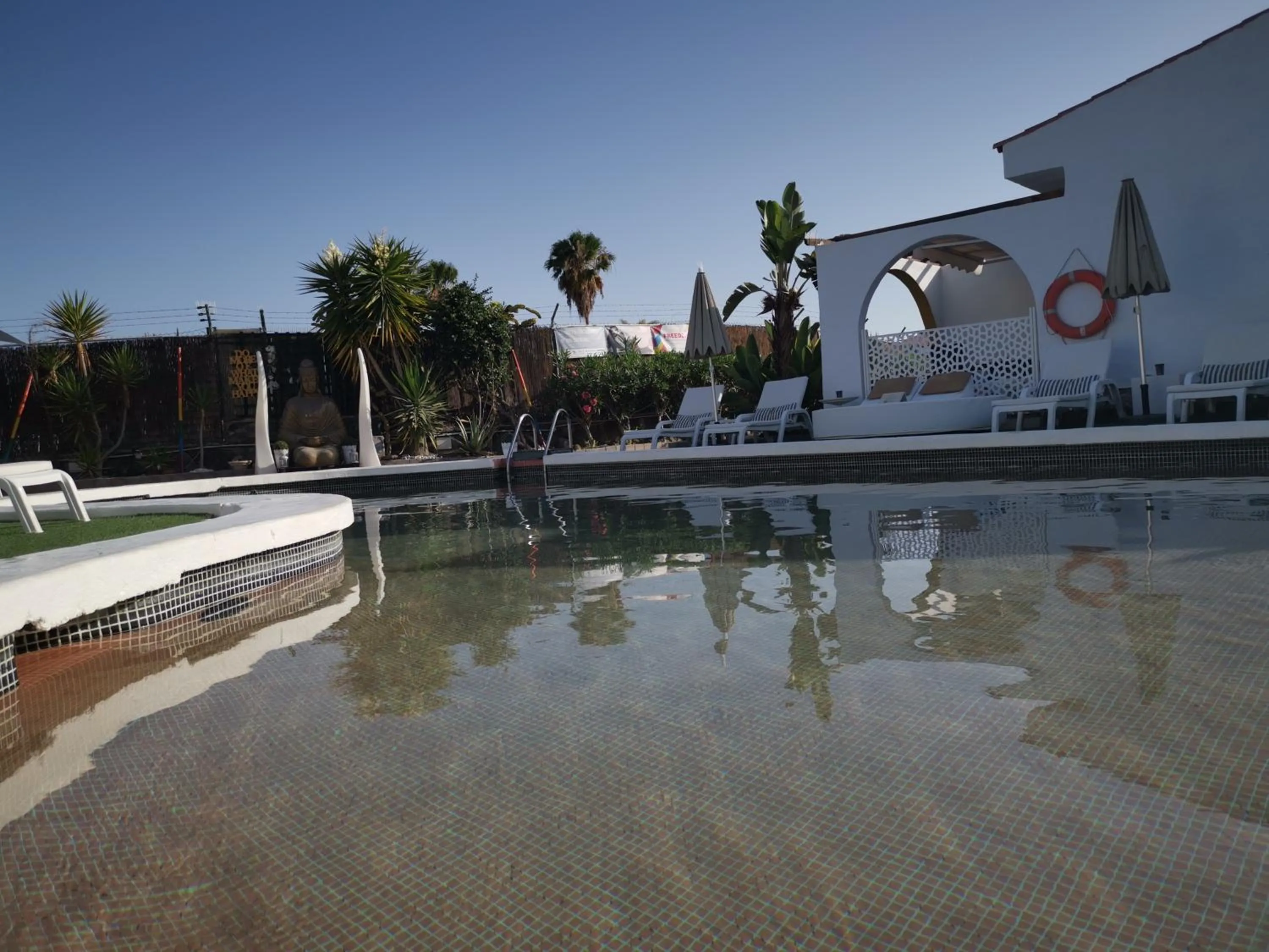 Swimming pool in Rainbow Golf Bungalows, Gay Men-only Resort