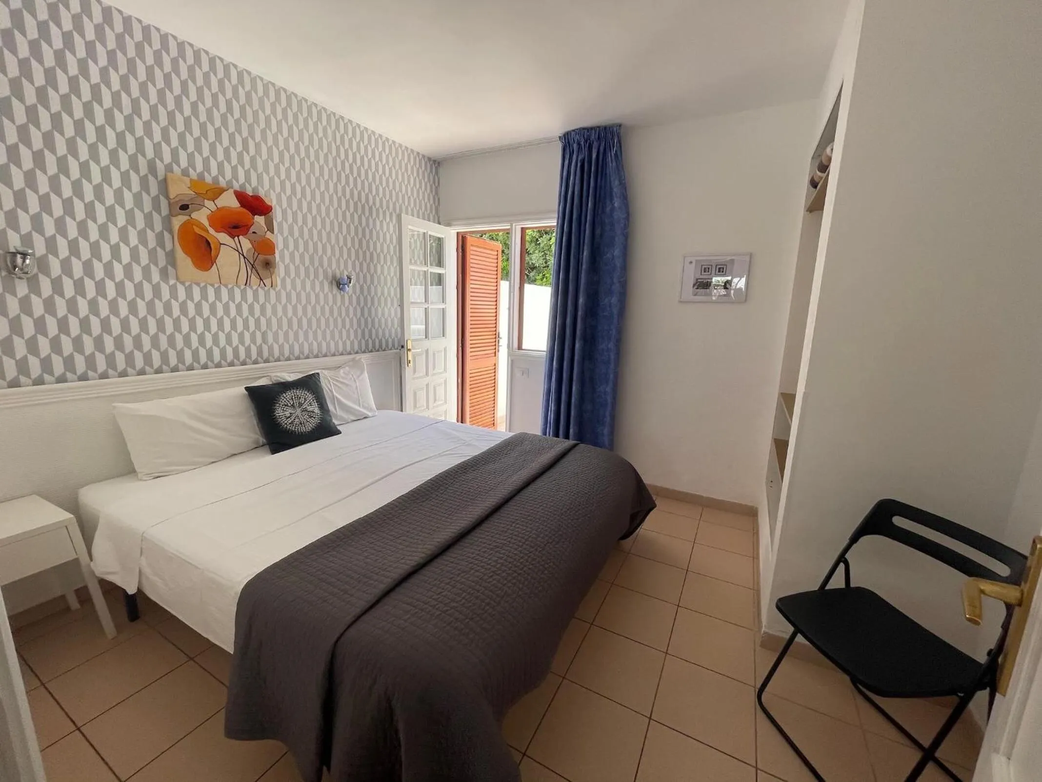 Bed in Rainbow Golf Bungalows, Gay Men-only Resort