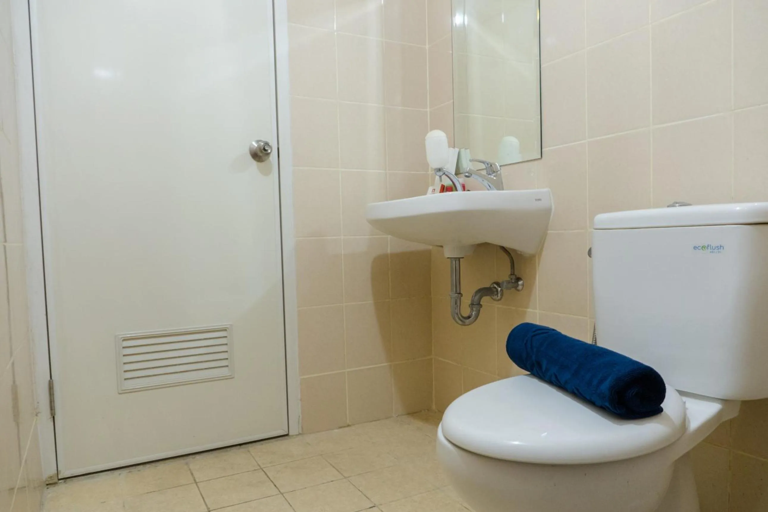 Minimalist 2BR Apartment at Parahyangan Residence By Travelio