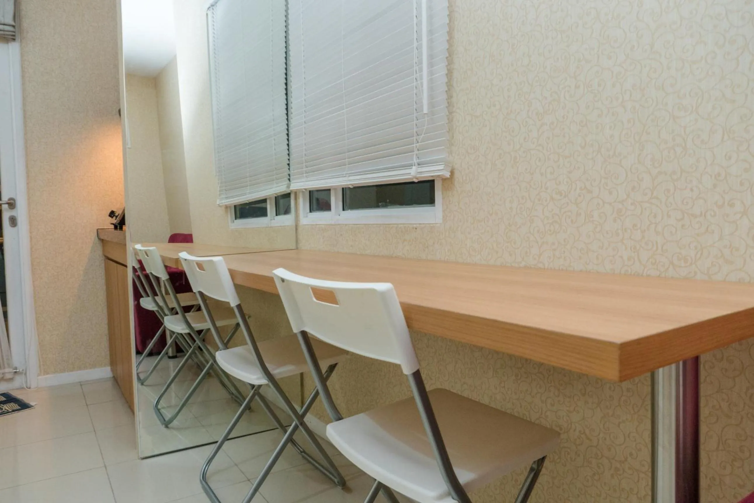 Minimalist 2BR Apartment at Parahyangan Residence By Travelio