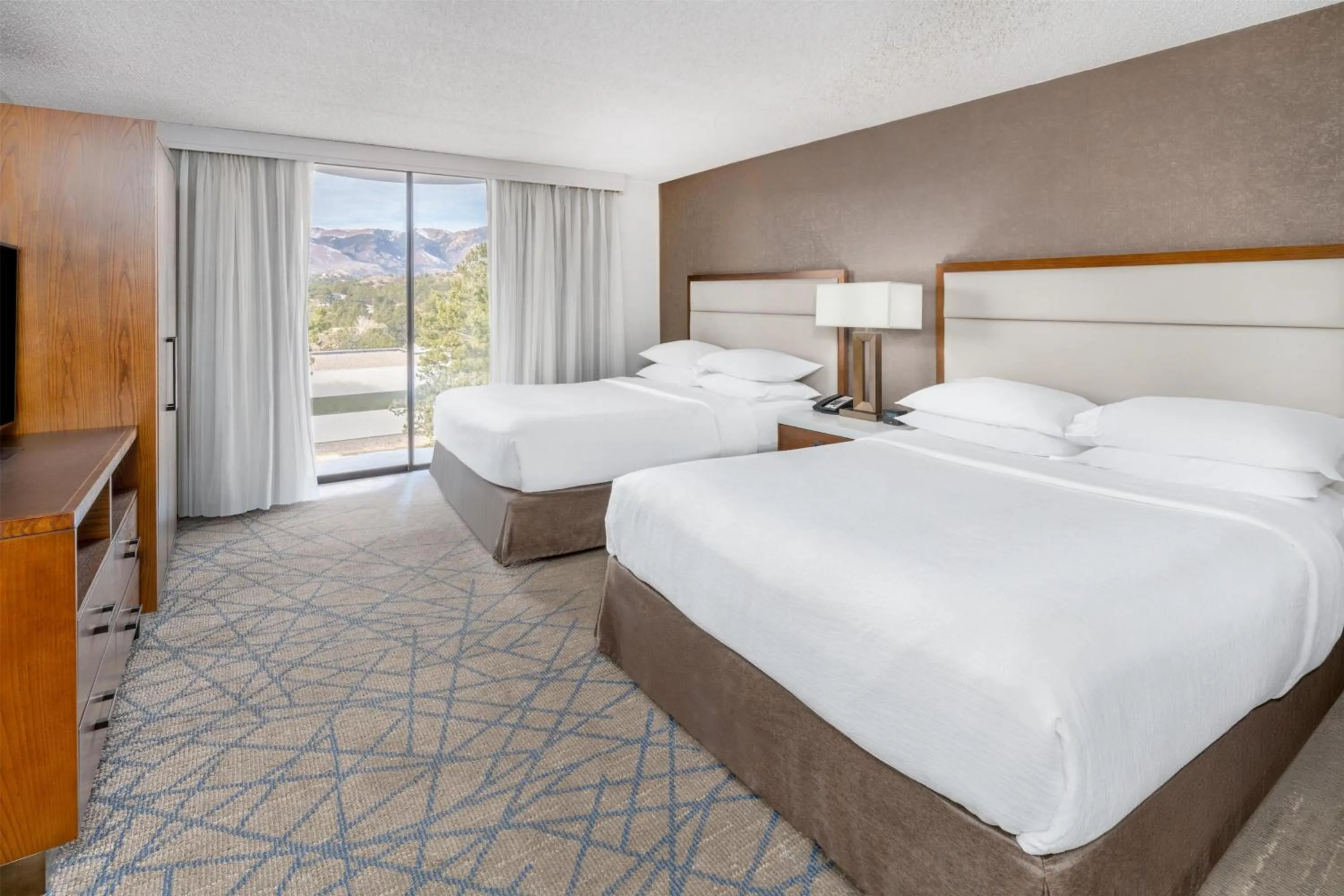 Bed in Embassy Suites by Hilton Colorado Springs