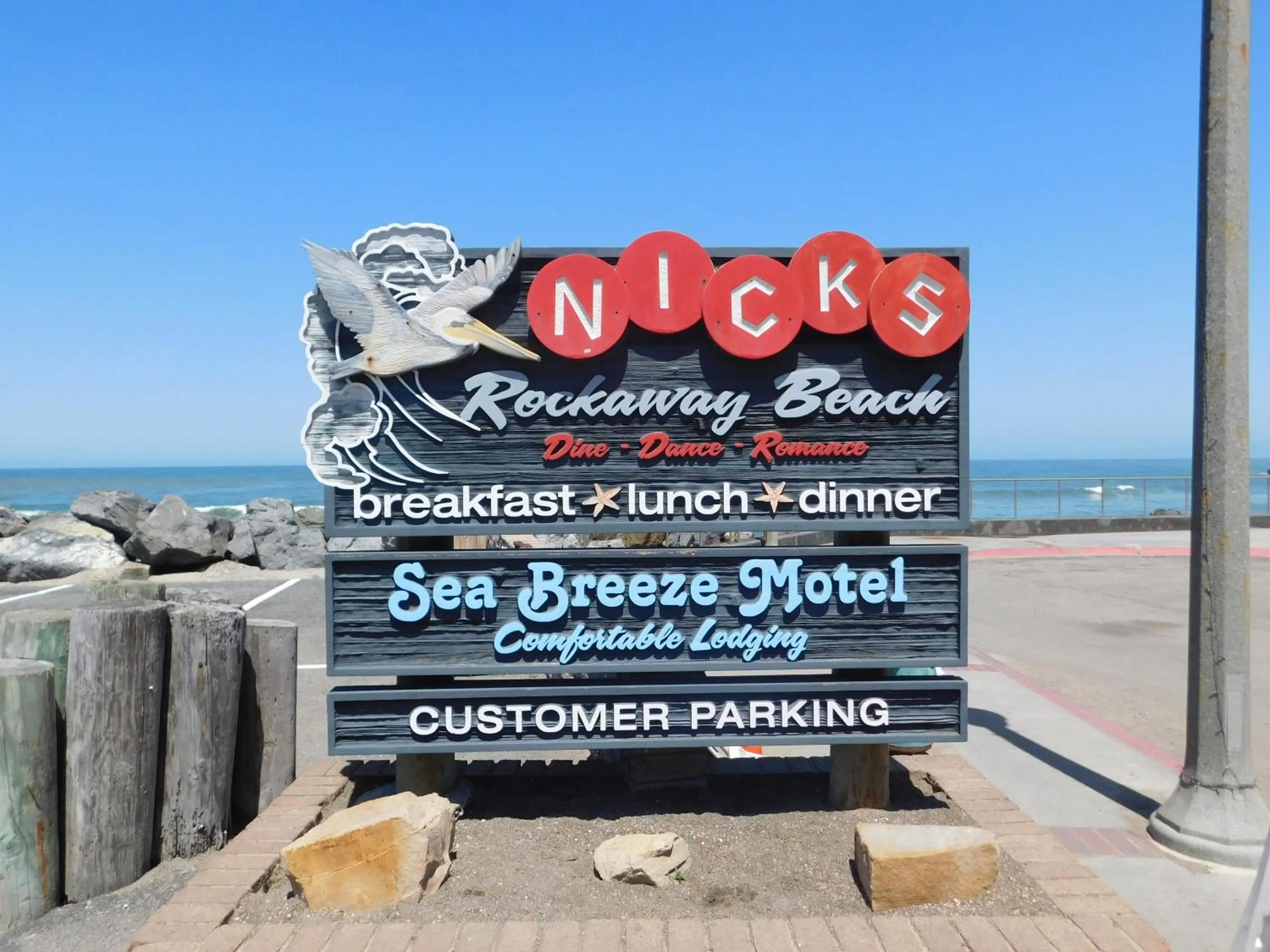 Property logo or sign in Sea Breeze Motel