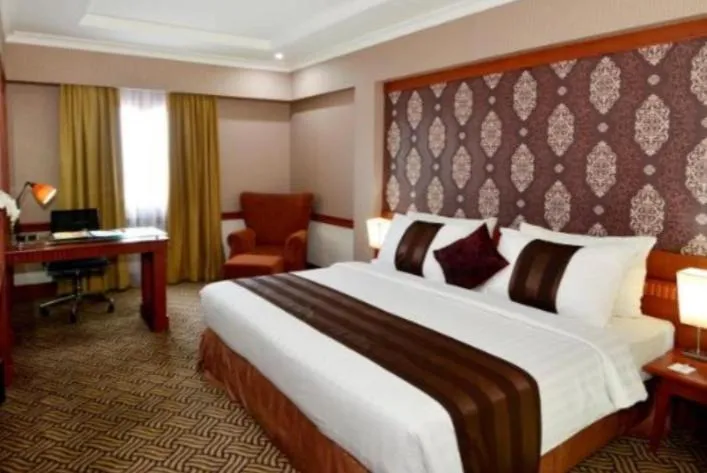 Bed in Abadi Suite Hotel & Tower