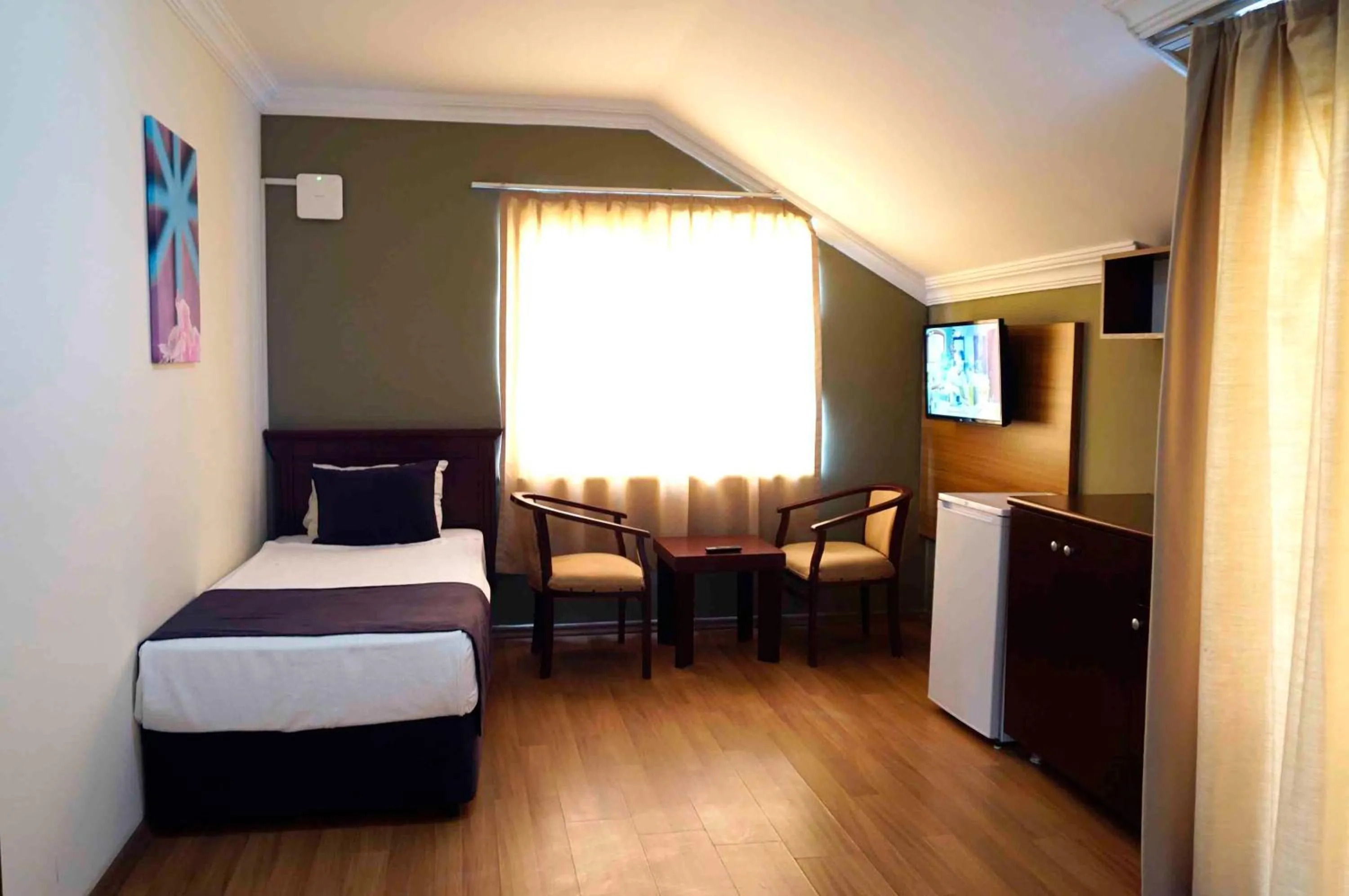 Bed in Sunlight Garden Hotel