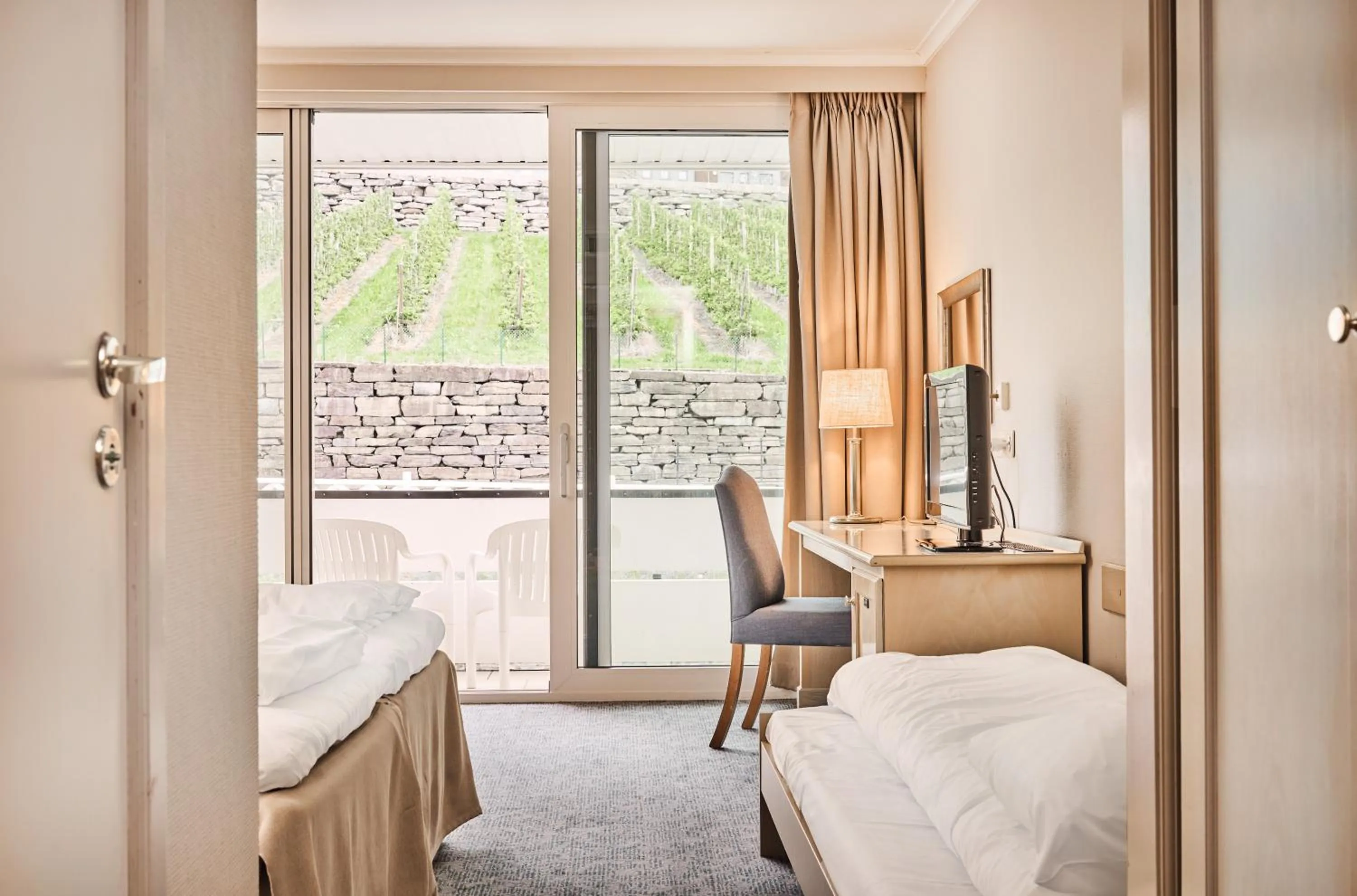 Seating area, Bed in Hotel Ullensvang