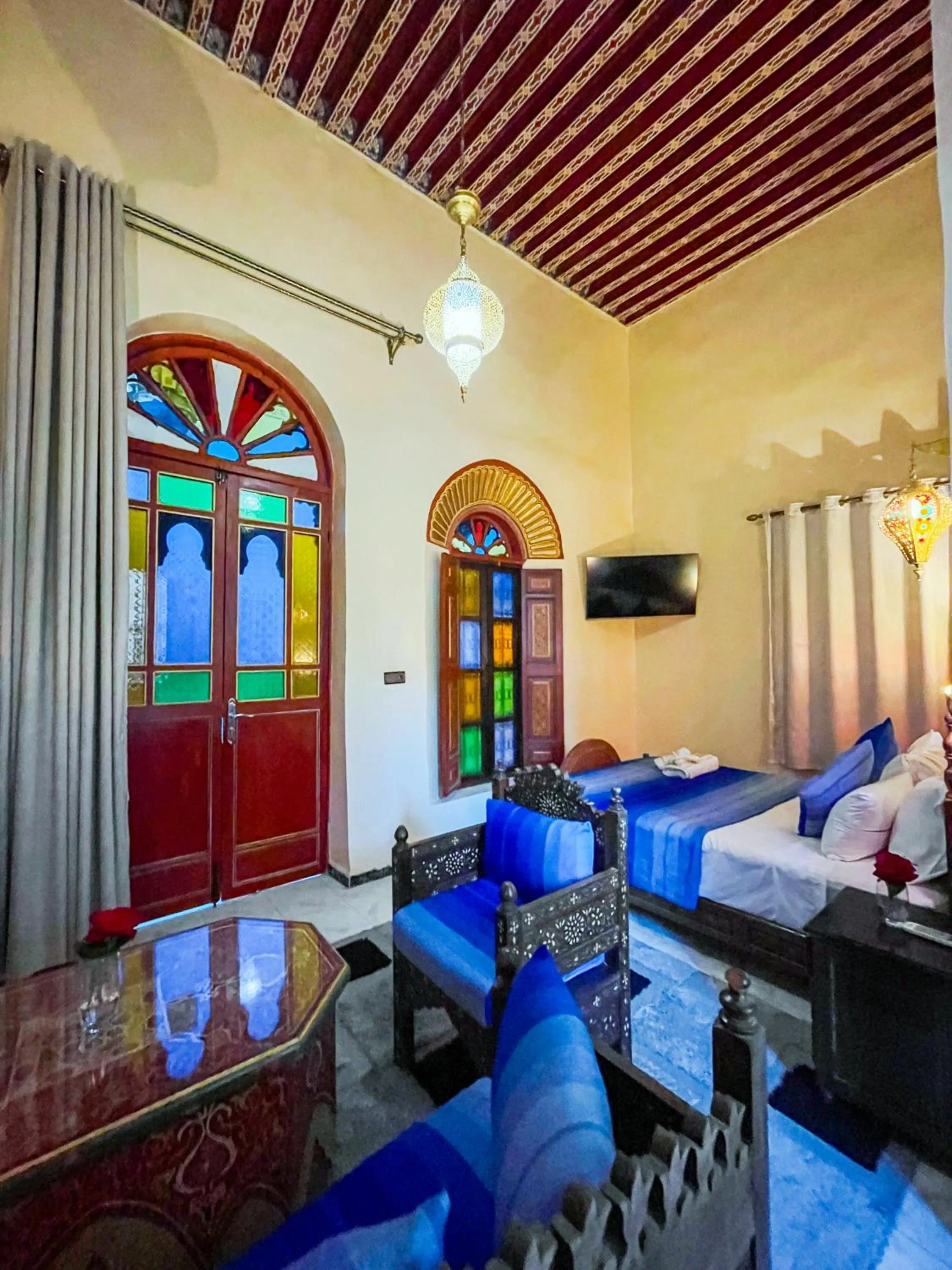 Communal lounge/ TV room, Bed in Riad Dar El Ouedghiri