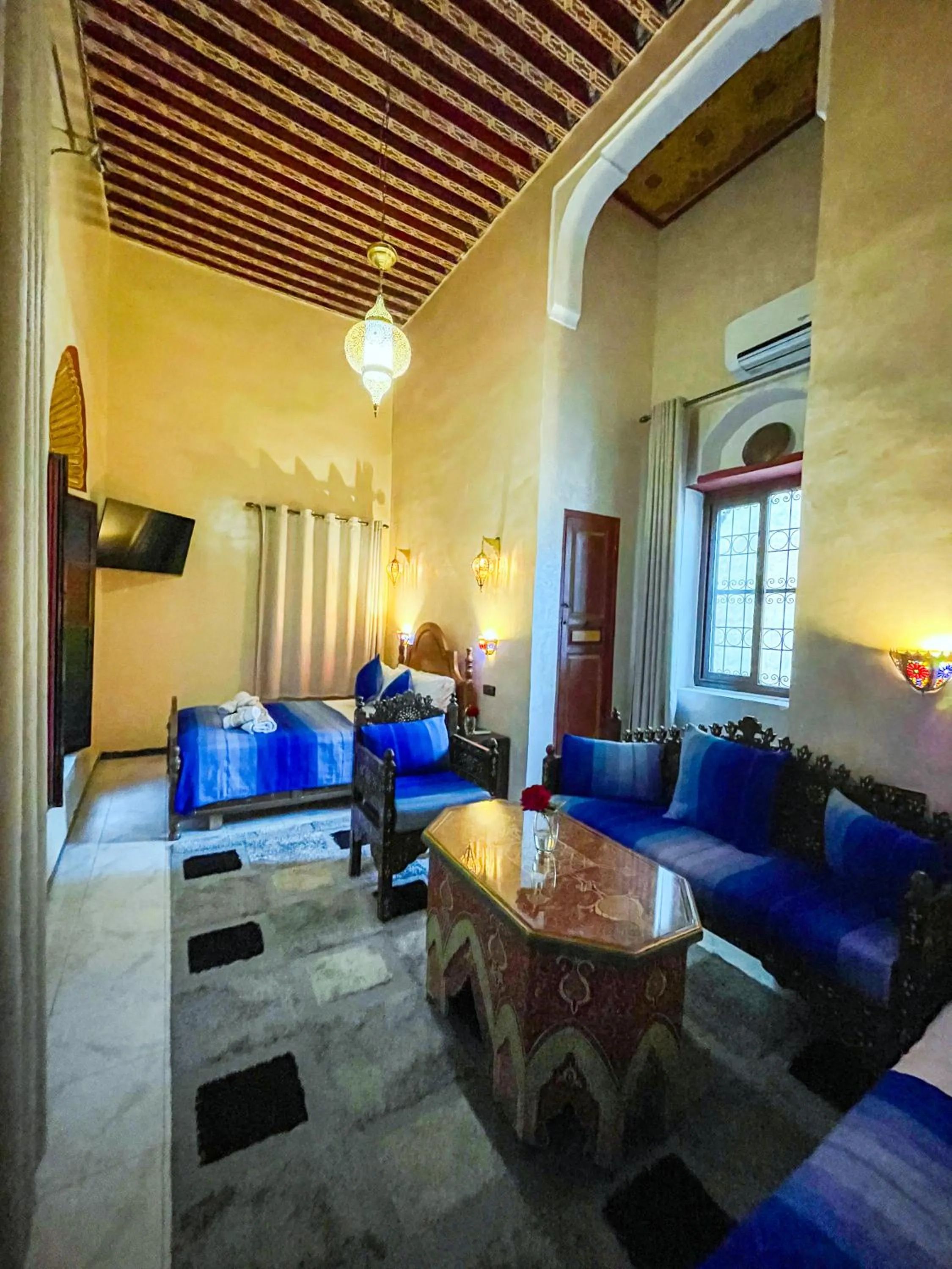 Communal lounge/ TV room in Riad Dar El Ouedghiri