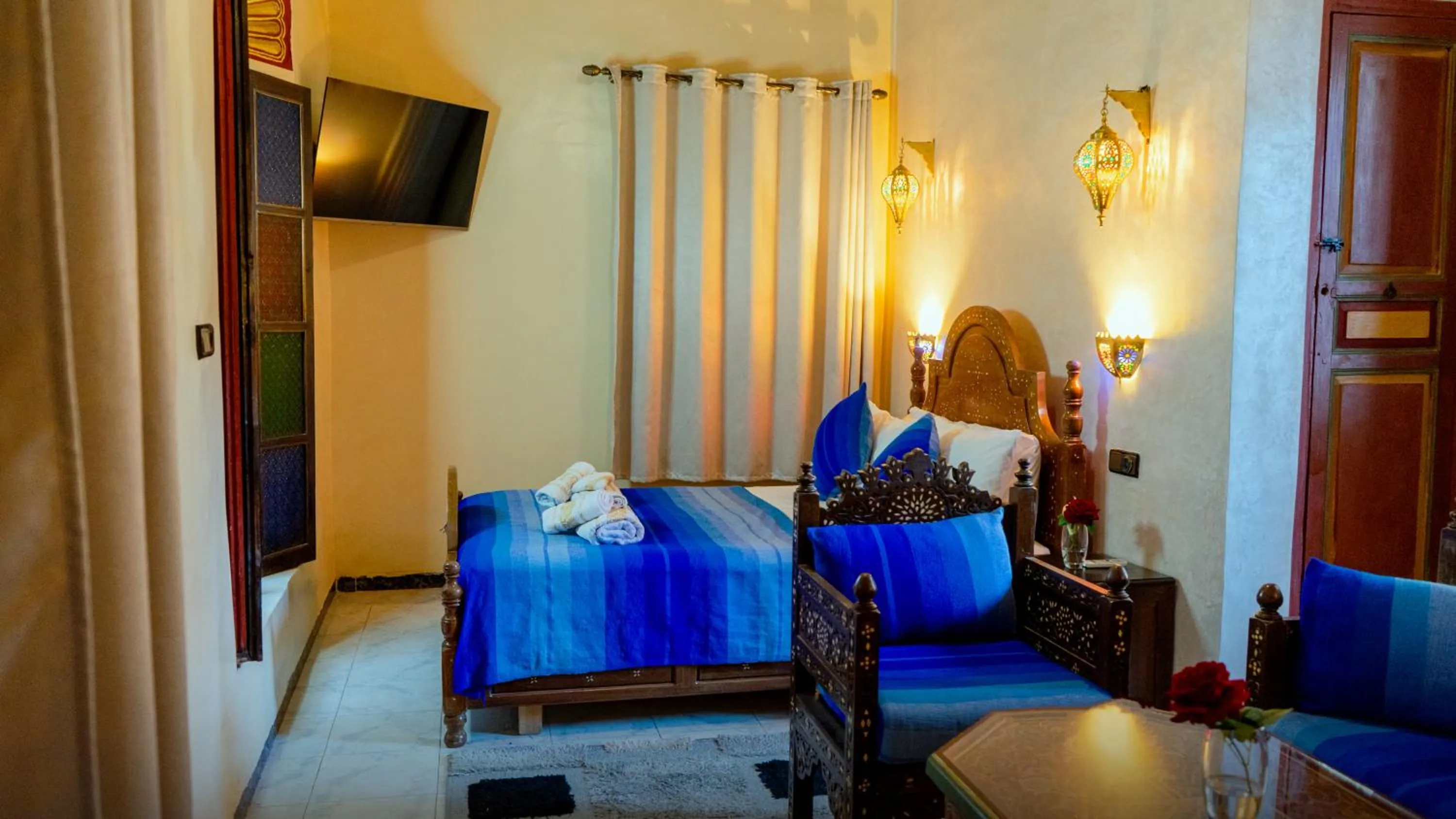 Communal lounge/ TV room, Bed in Riad Dar El Ouedghiri