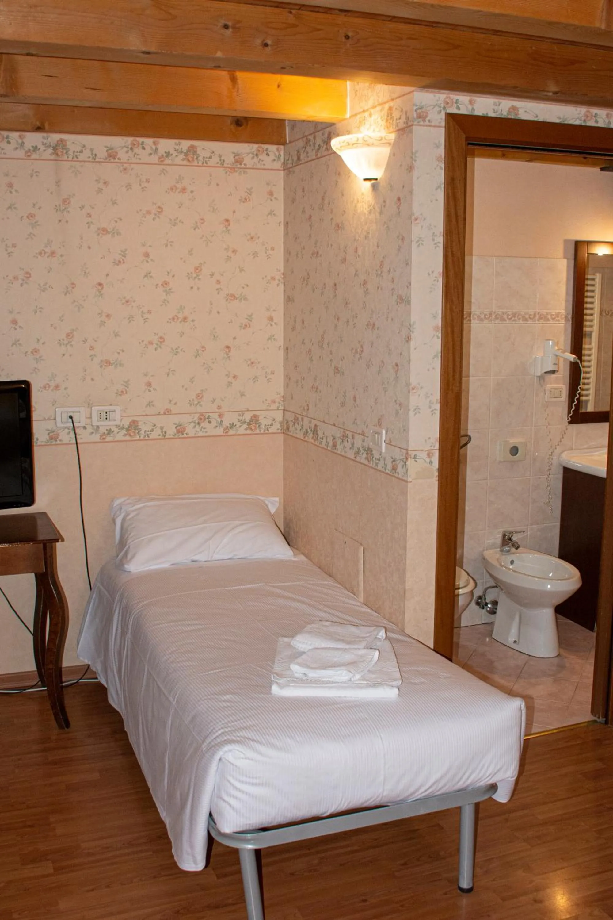 Bed in Hotel Capitelli
