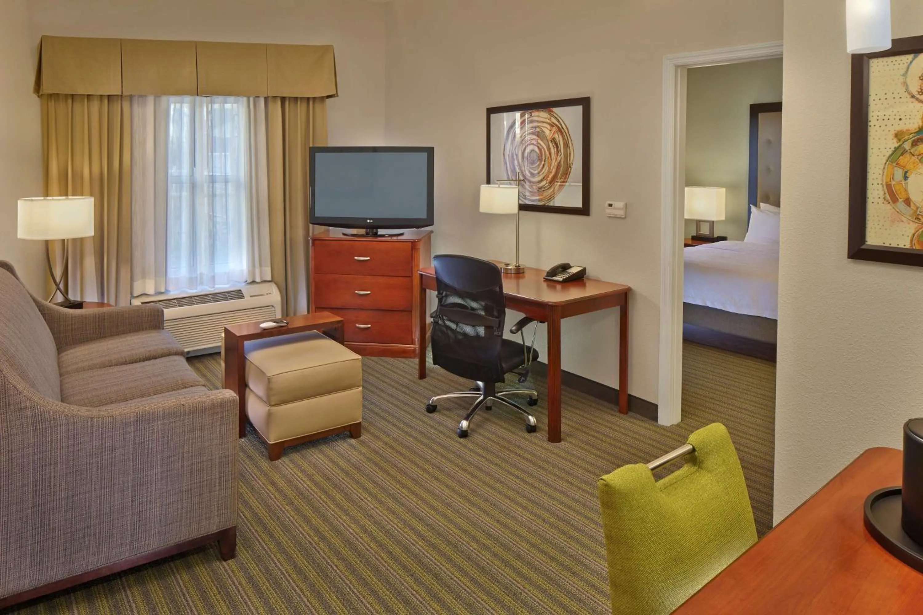 Living room, Bed in Homewood Suites by Hilton Daytona Beach Speedway-Airport