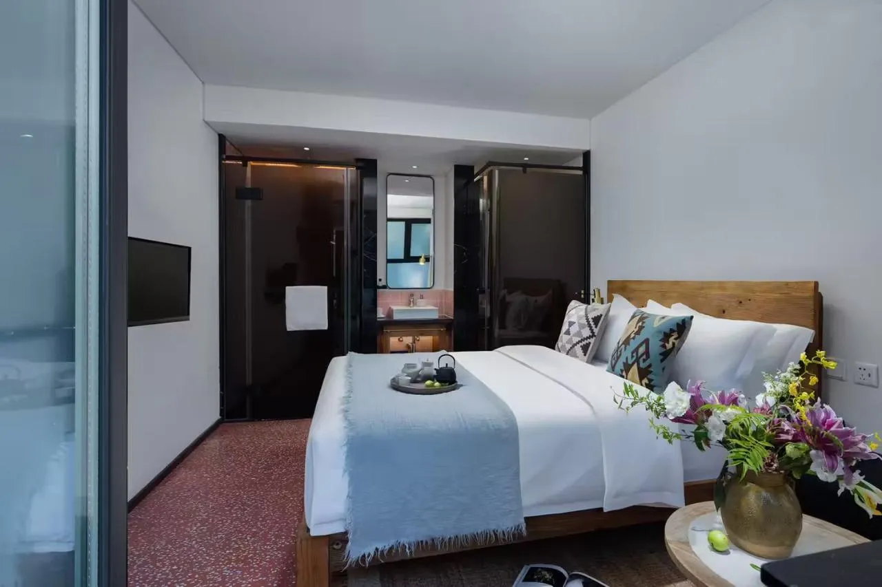 Bed in Peking Yard Boutique Hotel