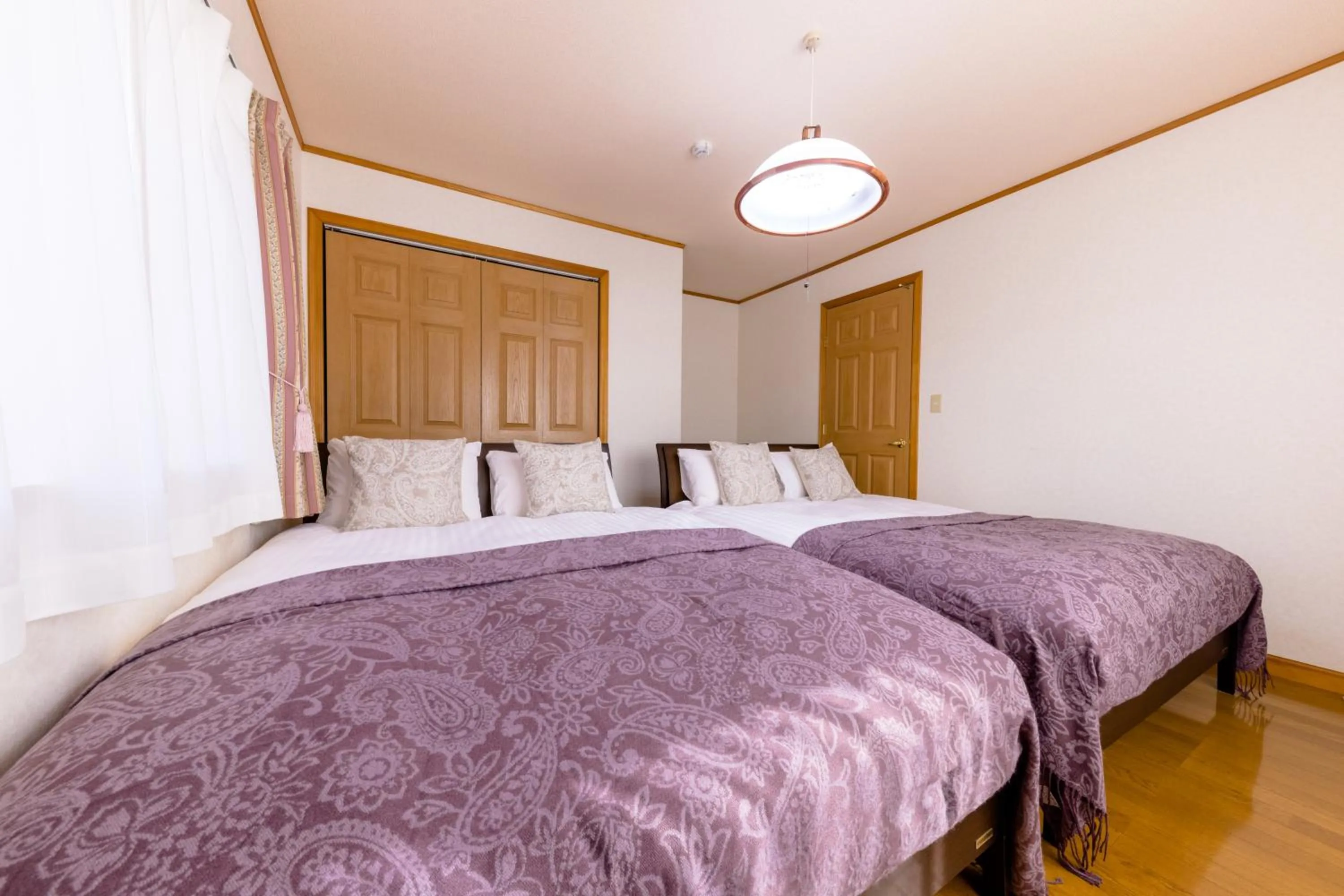 Bed in Ma Maison Mt. Fuji Kawaguchiko