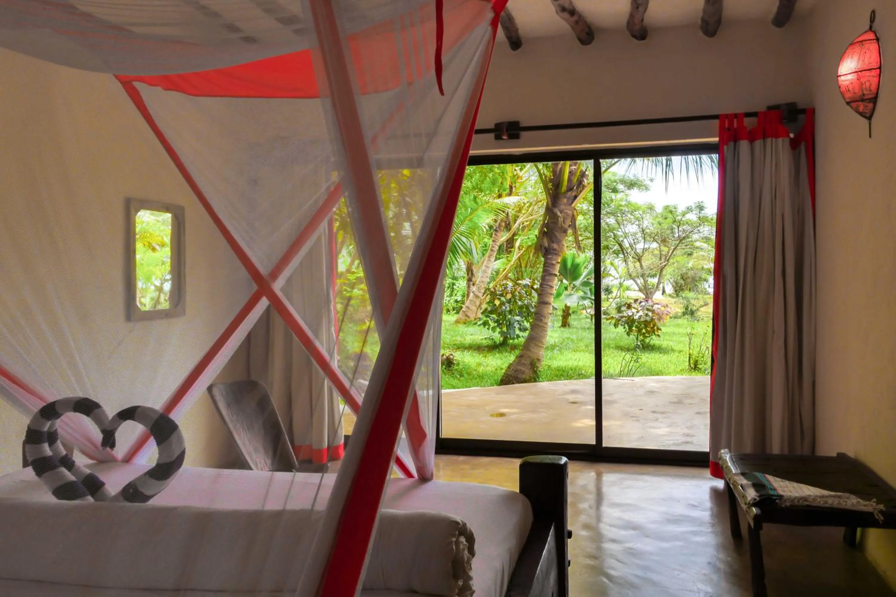 Garden view, Bed in The Zanzibari