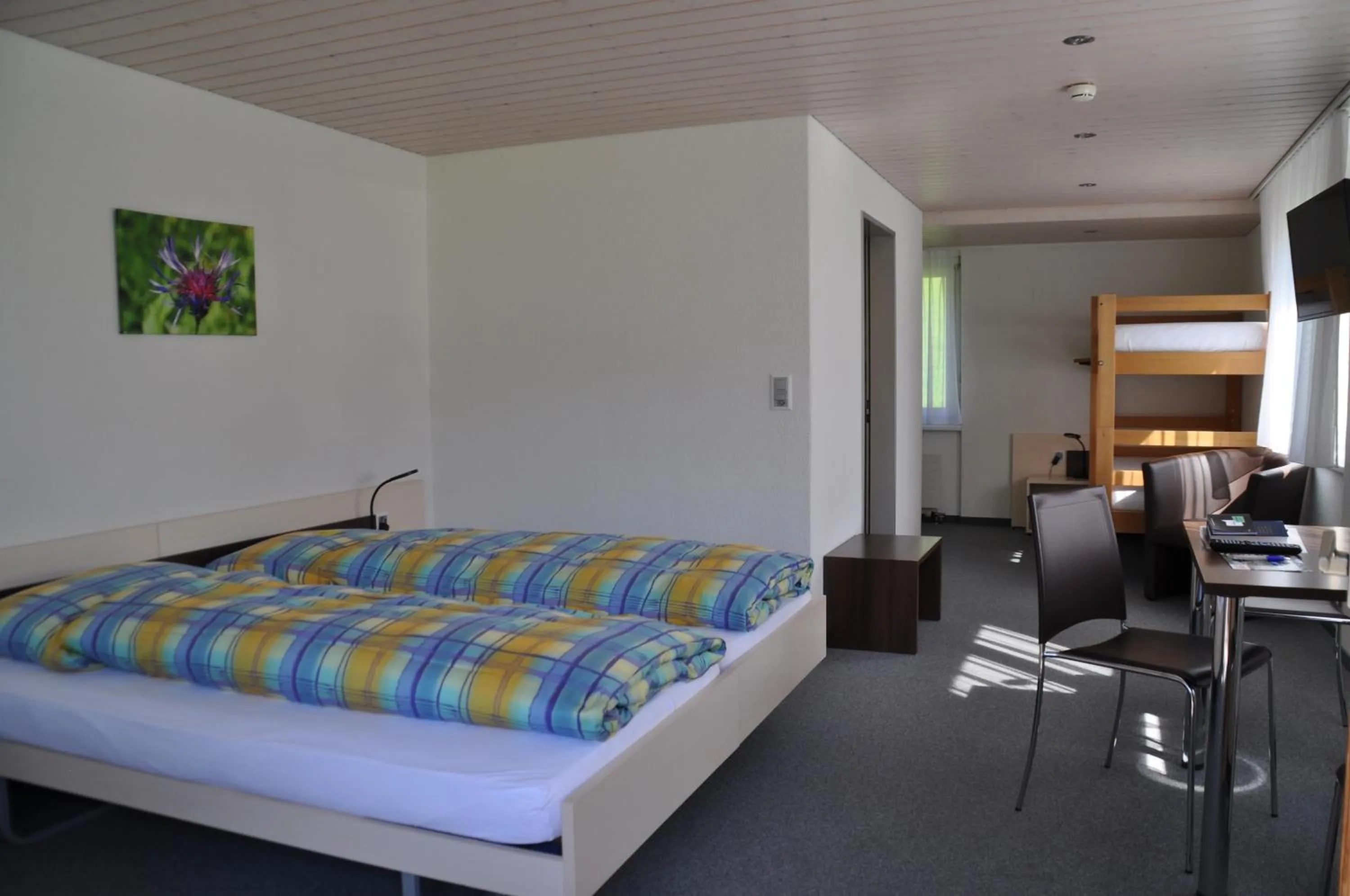 Photo of the whole room, Bed in Ferien- und Familienhotel Alpina Adelboden