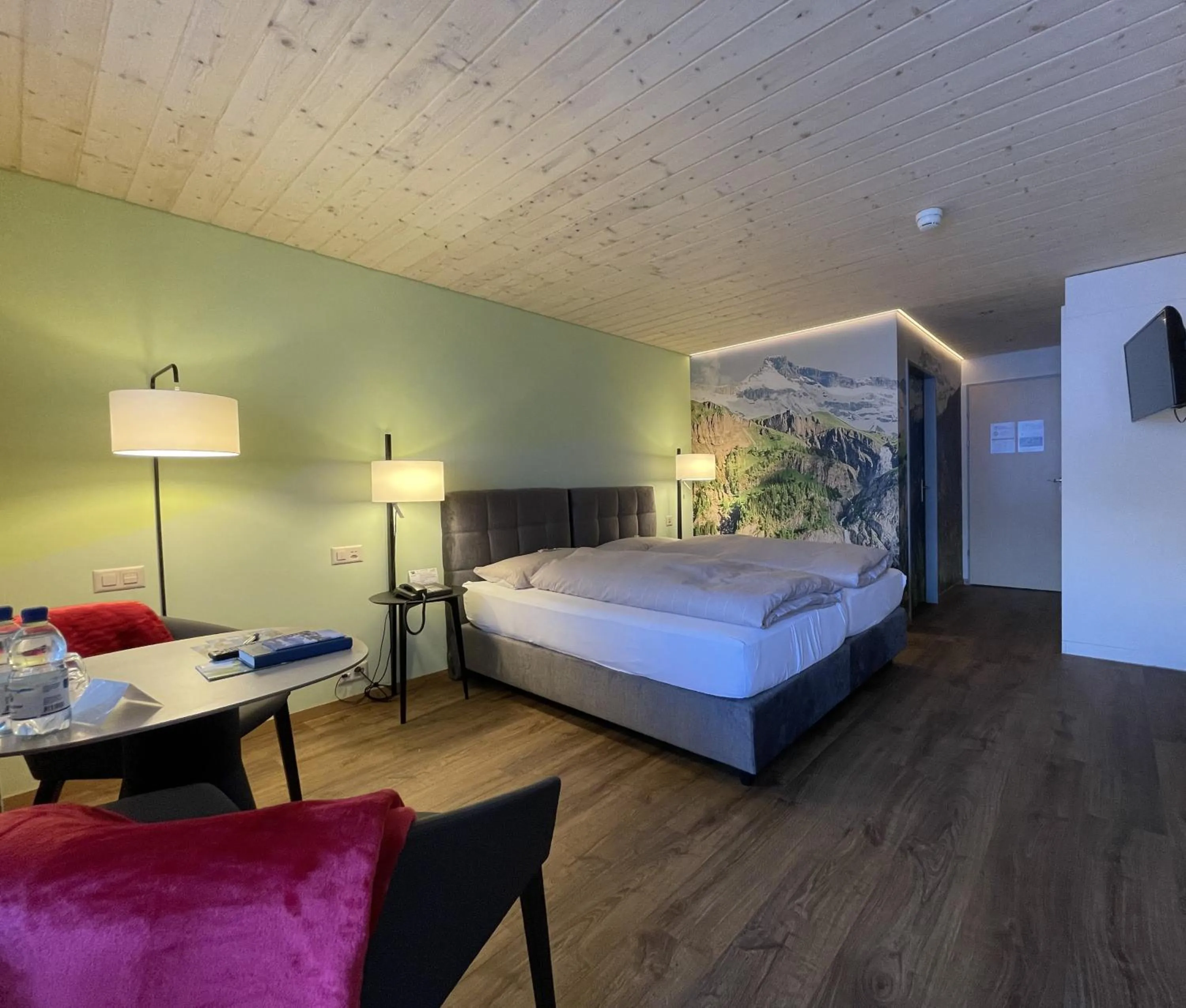 Photo of the whole room, Bed in Ferien- und Familienhotel Alpina Adelboden