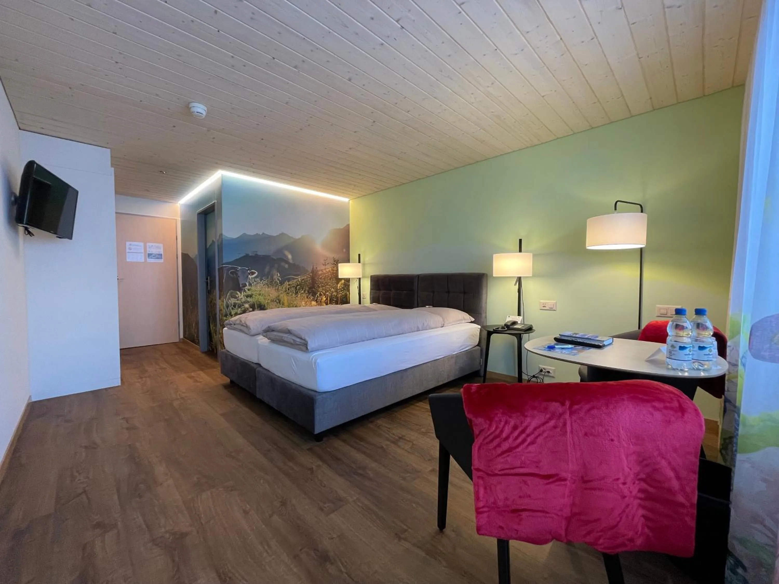 Photo of the whole room, Bed in Ferien- und Familienhotel Alpina Adelboden