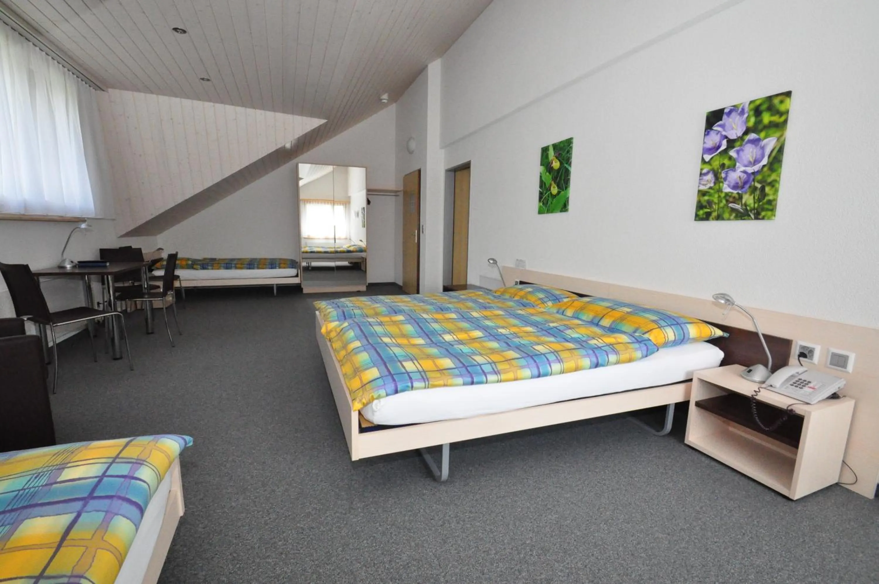 Photo of the whole room, Bed in Ferien- und Familienhotel Alpina Adelboden
