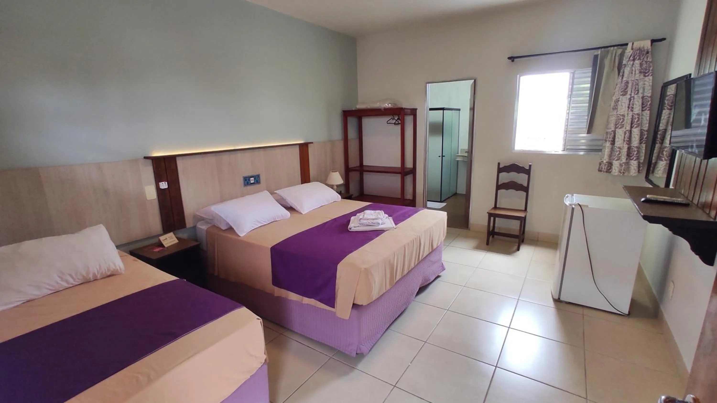 Bed in Pousada Novo Prado