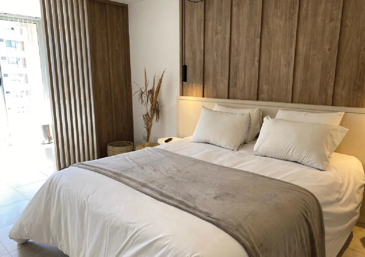 Bed in Departamentos Lugar